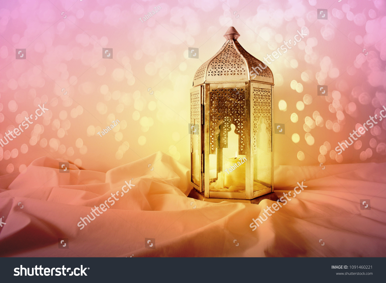 Ornamental silver Moroccan, Arabic lantern on linen throw. Burning candle, glittering colorful bokeh lights. Greeting card for Muslim community holy month Ramadan Kareem. Festive background. #1091460221