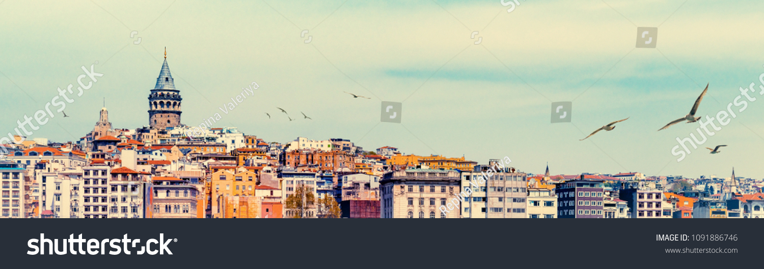 Wide angle panorama of Istanbul with Galata Tower at skyline and seagulls over the old town. Panoramic view on medieval tower as travel background for banner with space for your text on the top. #1091886746