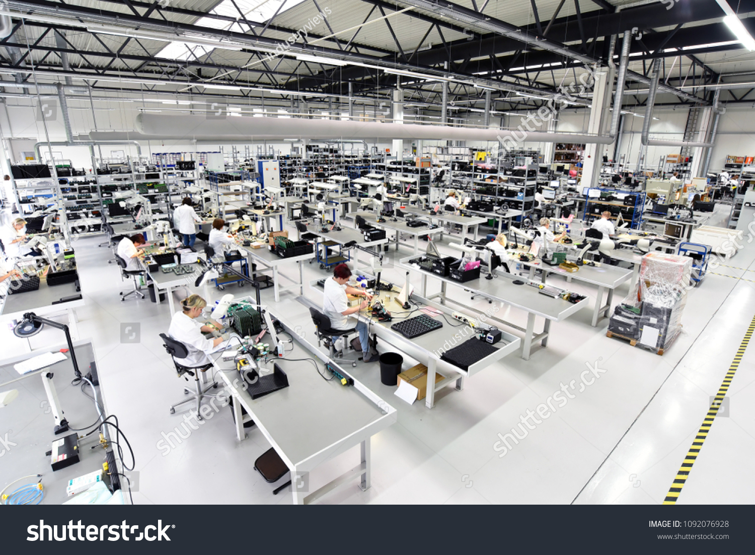 industrial factory for assembly of microelectronics - interior and workers  #1092076928
