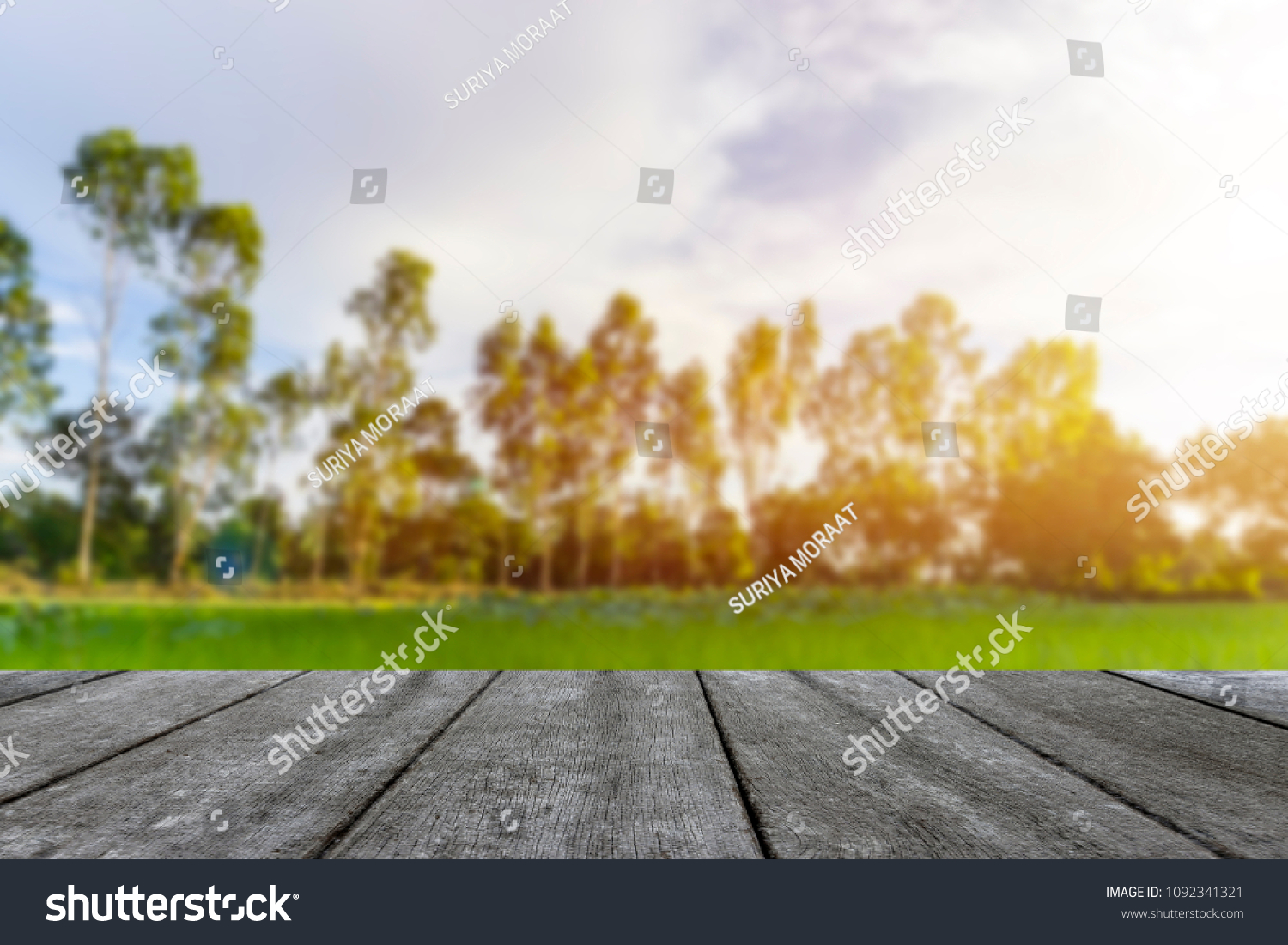 Wooden table blurred background of landscape with blue sky  #1092341321