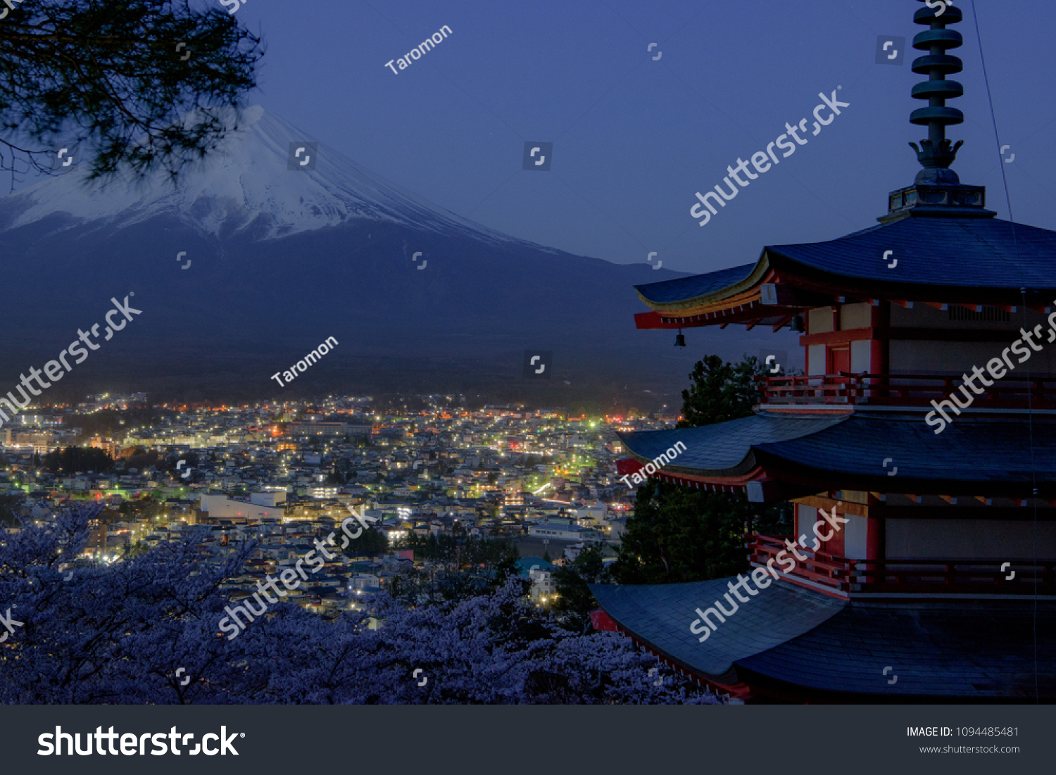 Mount Fuji and Chureito Pagoda at night in spring, Japan. The Pagoda is in Arakura Sengen Shrine one of the most famous tourist attraction where tourist can see Mt Fuji from panoramic view #1094485481