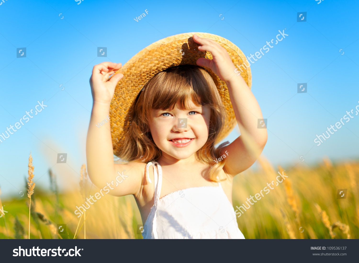 Beautiful little girl on the meadow in summer day #109536137