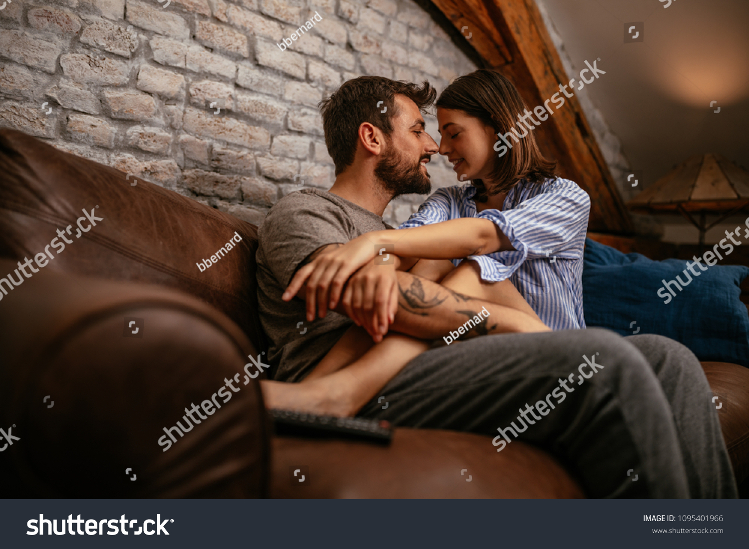 Young affectionate couple relaxing at home #1095401966