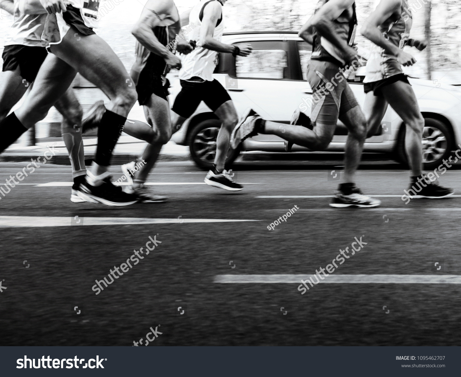 group men runners running street on marathon black-and-white image #1095462707