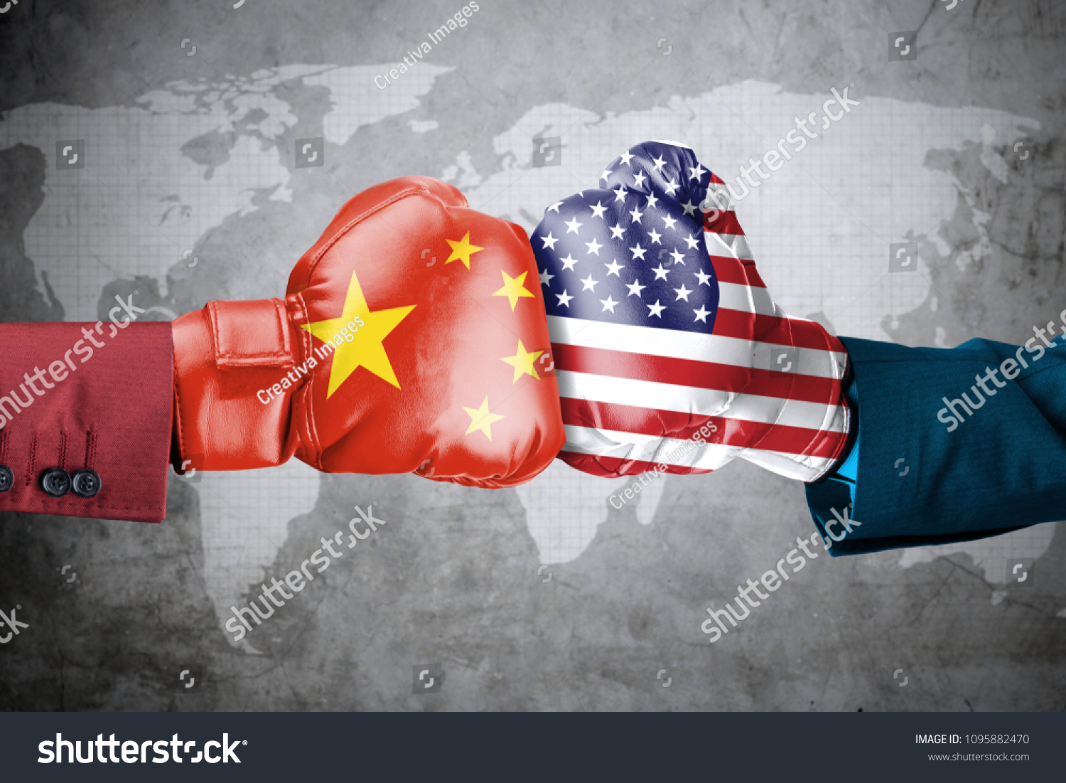 Concept of trade war between USA and China. Two hands of wearing boxing gloves with China and USA flag over world map #1095882470