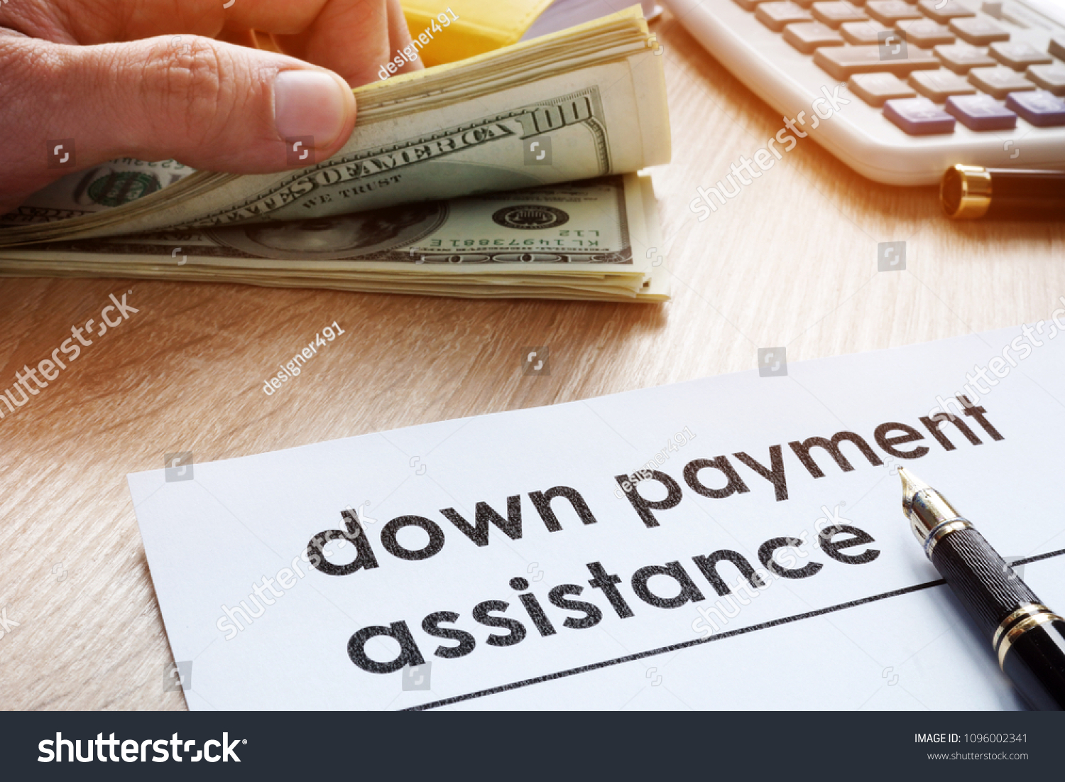 Down payment assistance form and dollar banknotes. #1096002341