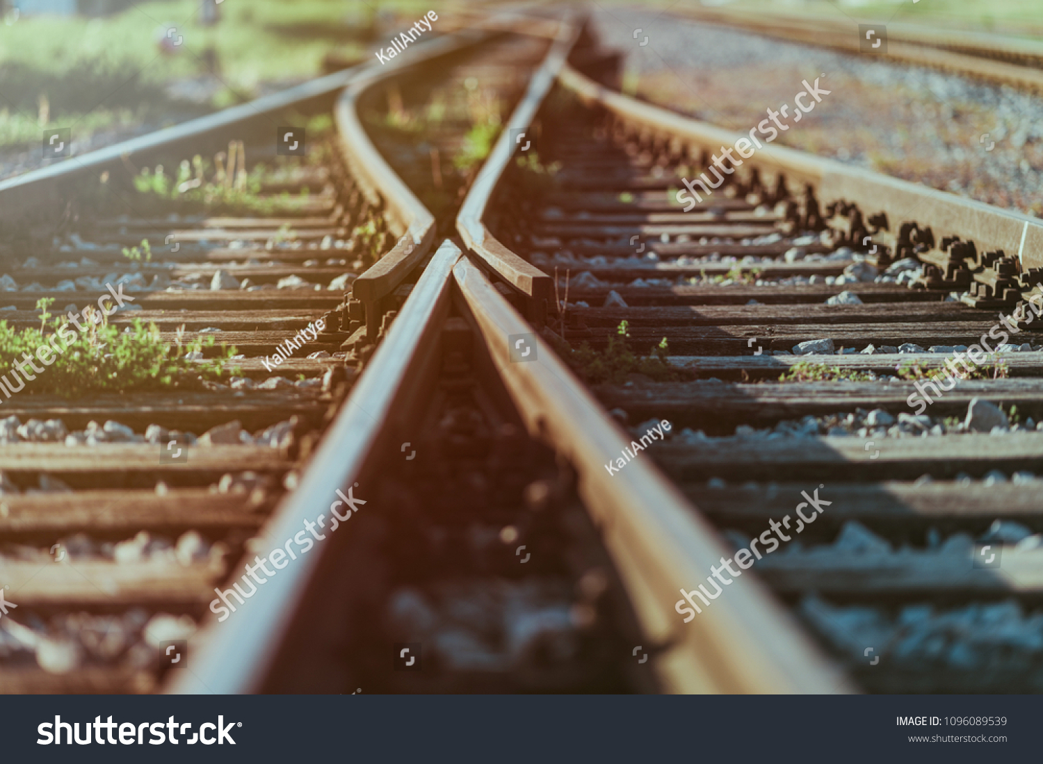 Railway crossroads. Choosing the right pathy, making decision, having doubts, choice way concept. Shallow depth of field. #1096089539