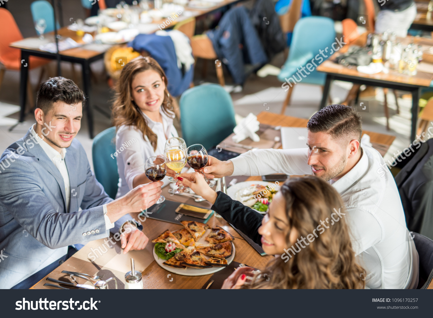 A group of business men and woman having a nice dinner. #1096170257