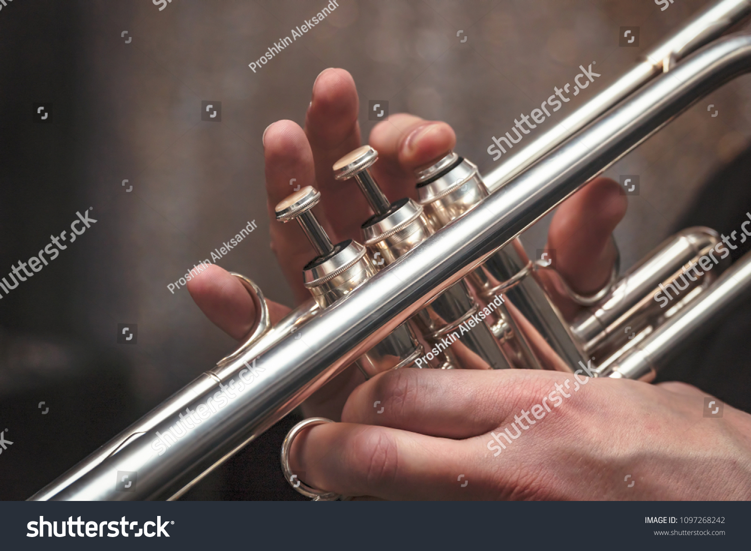 Hand of the Trumpeter on the buttons of the trumpet #1097268242