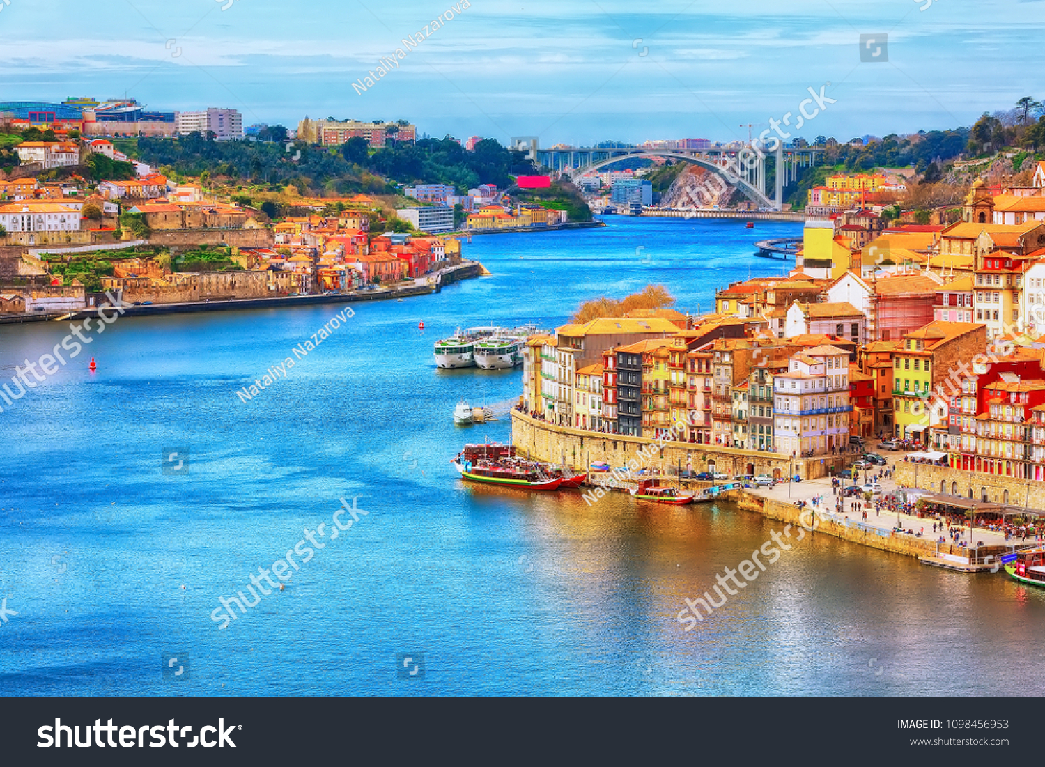 Porto, Portugal old town ribeira aerial promenade view with colorful houses, Douro river and boats #1098456953