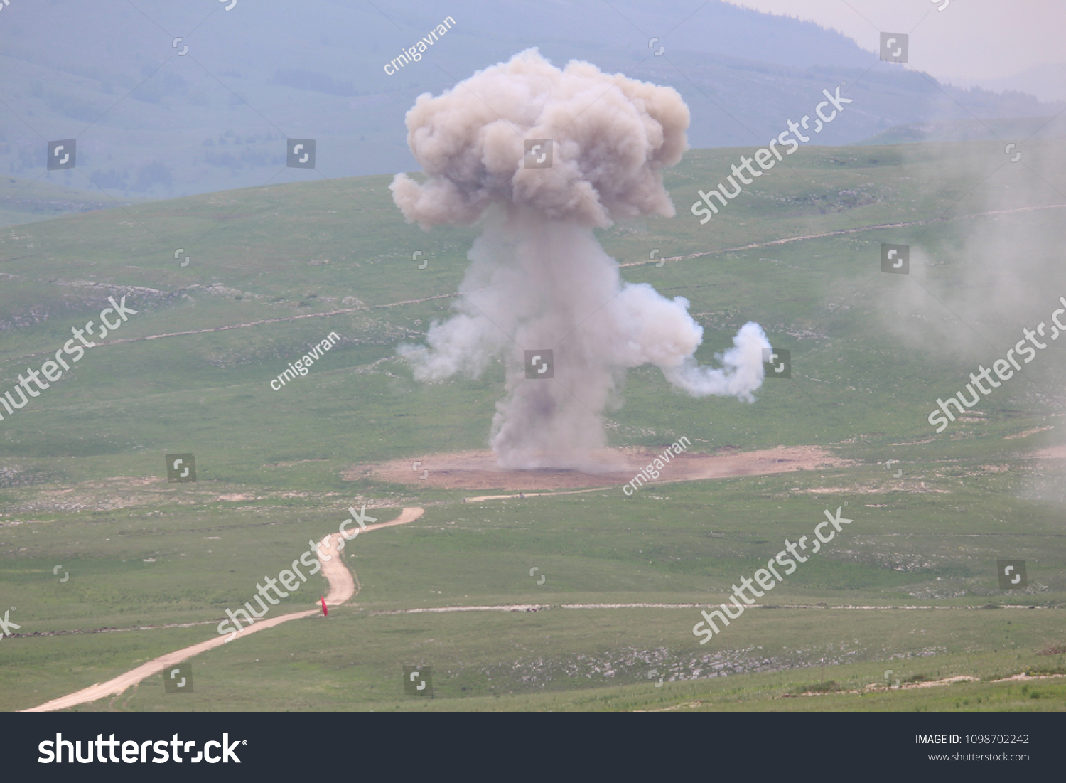 Explosion of military explosives in the open #1098702242