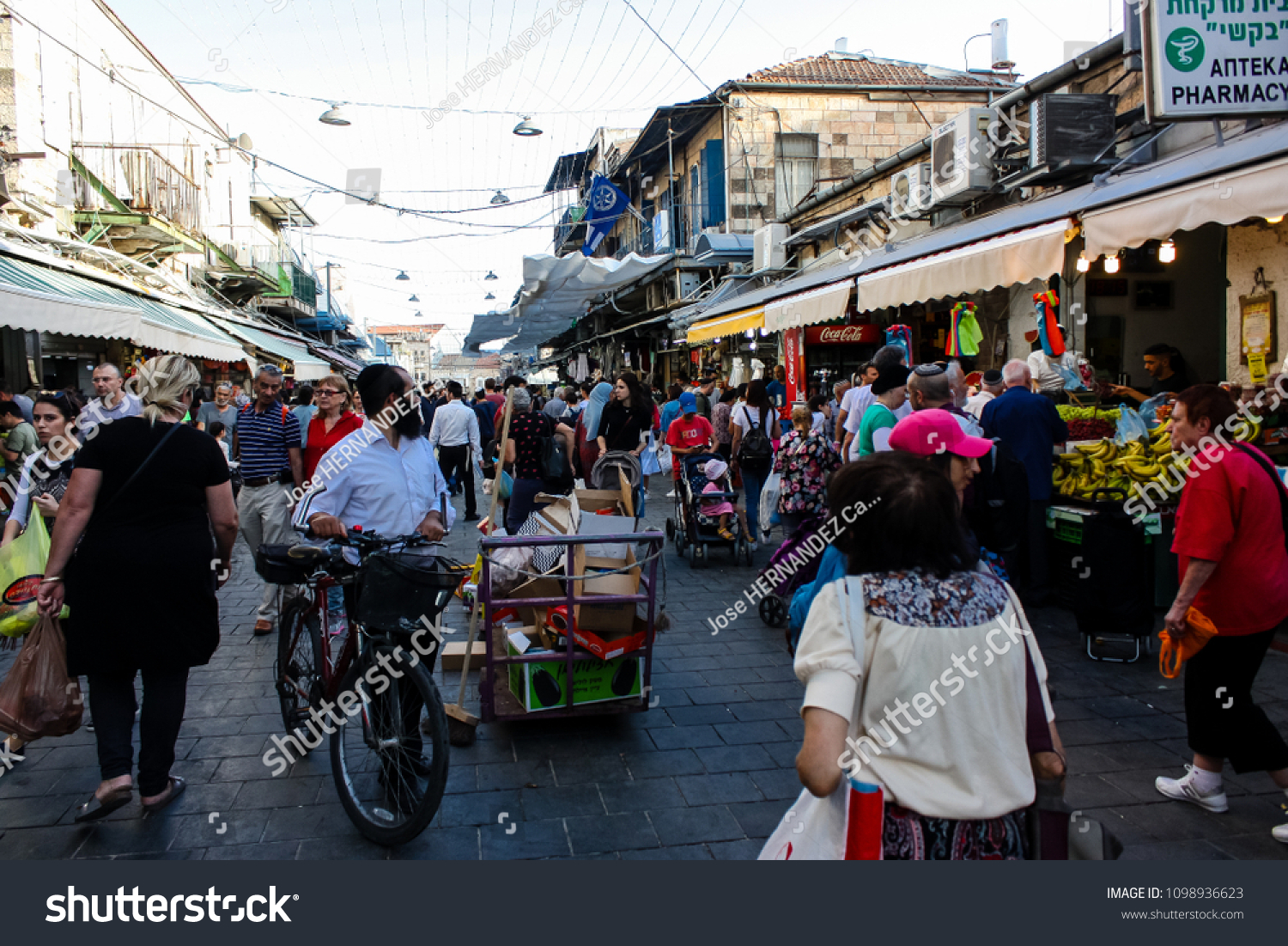 Jerusalem Israel May 24, 2018 Unknowns people walking and shopping at Mahane Yehuda market in Jerusalem afternoon #1098936623