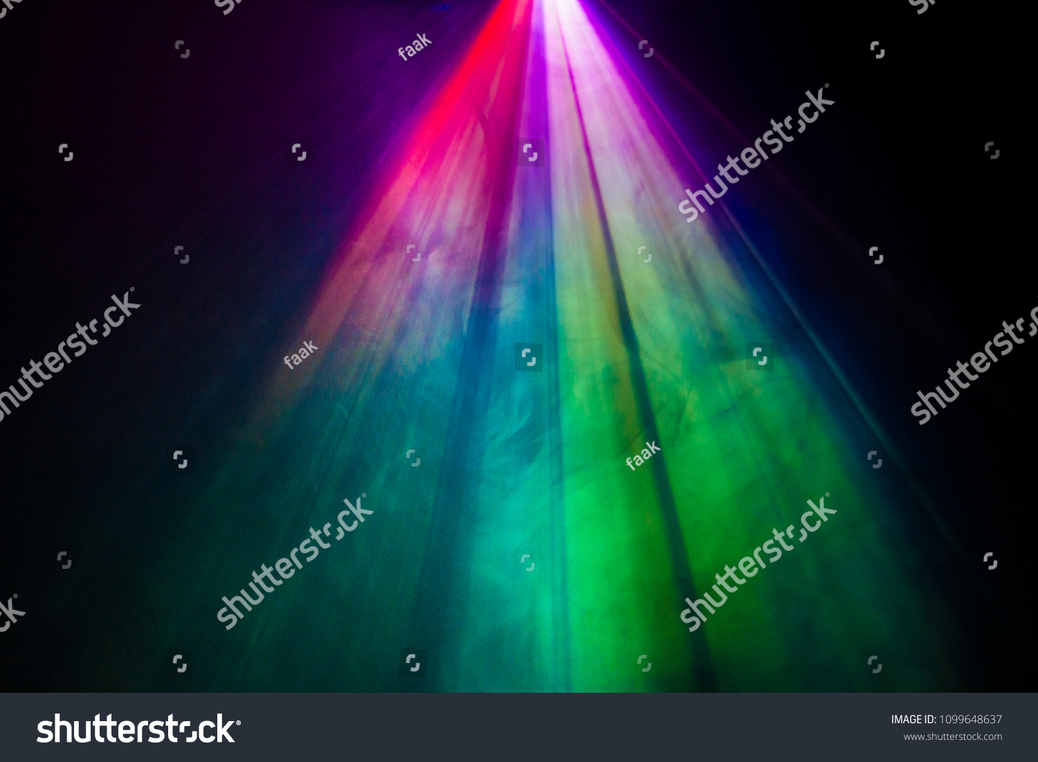 beautiful rainbow color wide lens projector with light beam for movie and cinema at night . smoke texture spotlight . screening for multimedia . black background . #1099648637