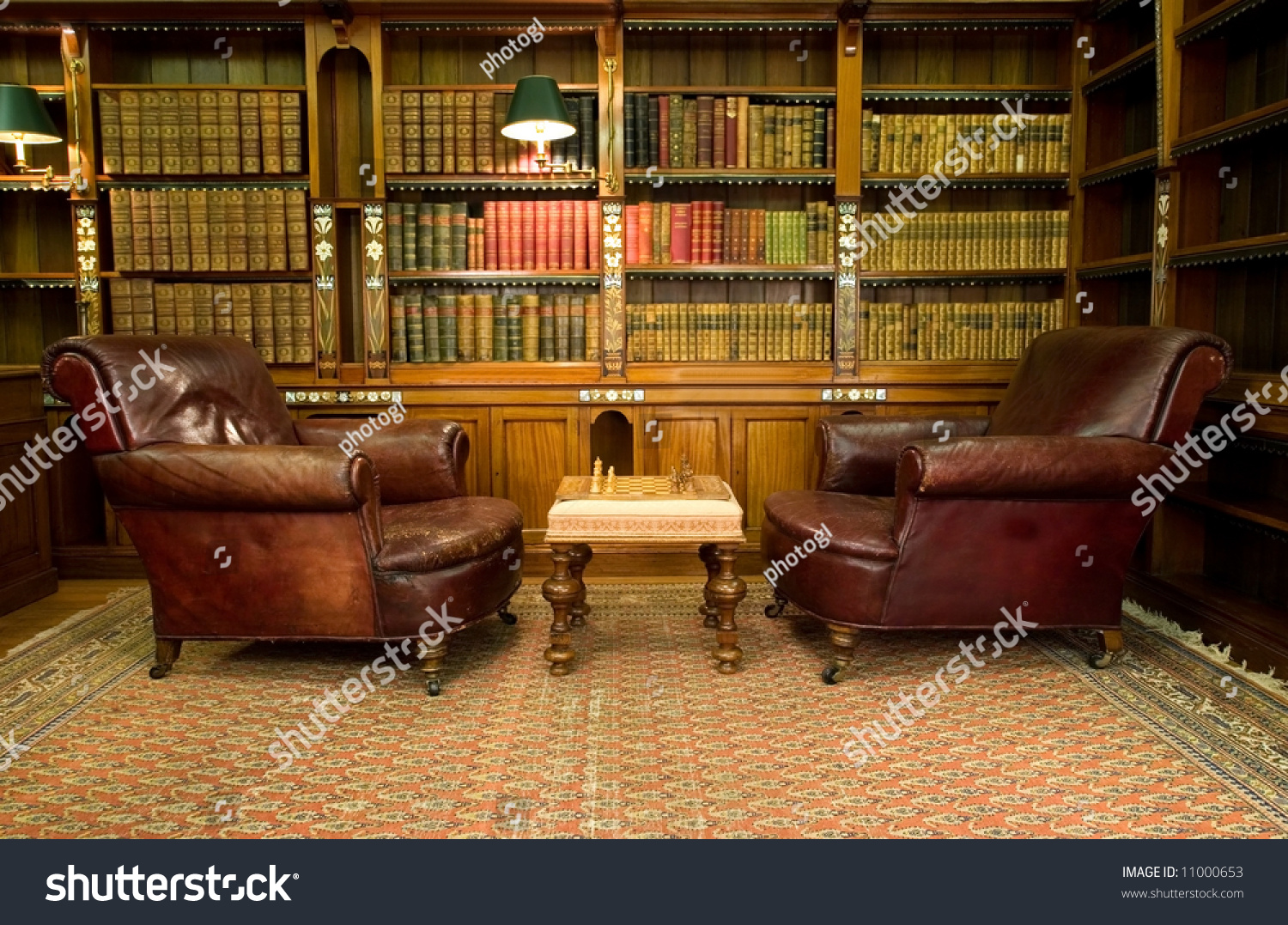 Old studying room with two leather armchairs and chess game #11000653