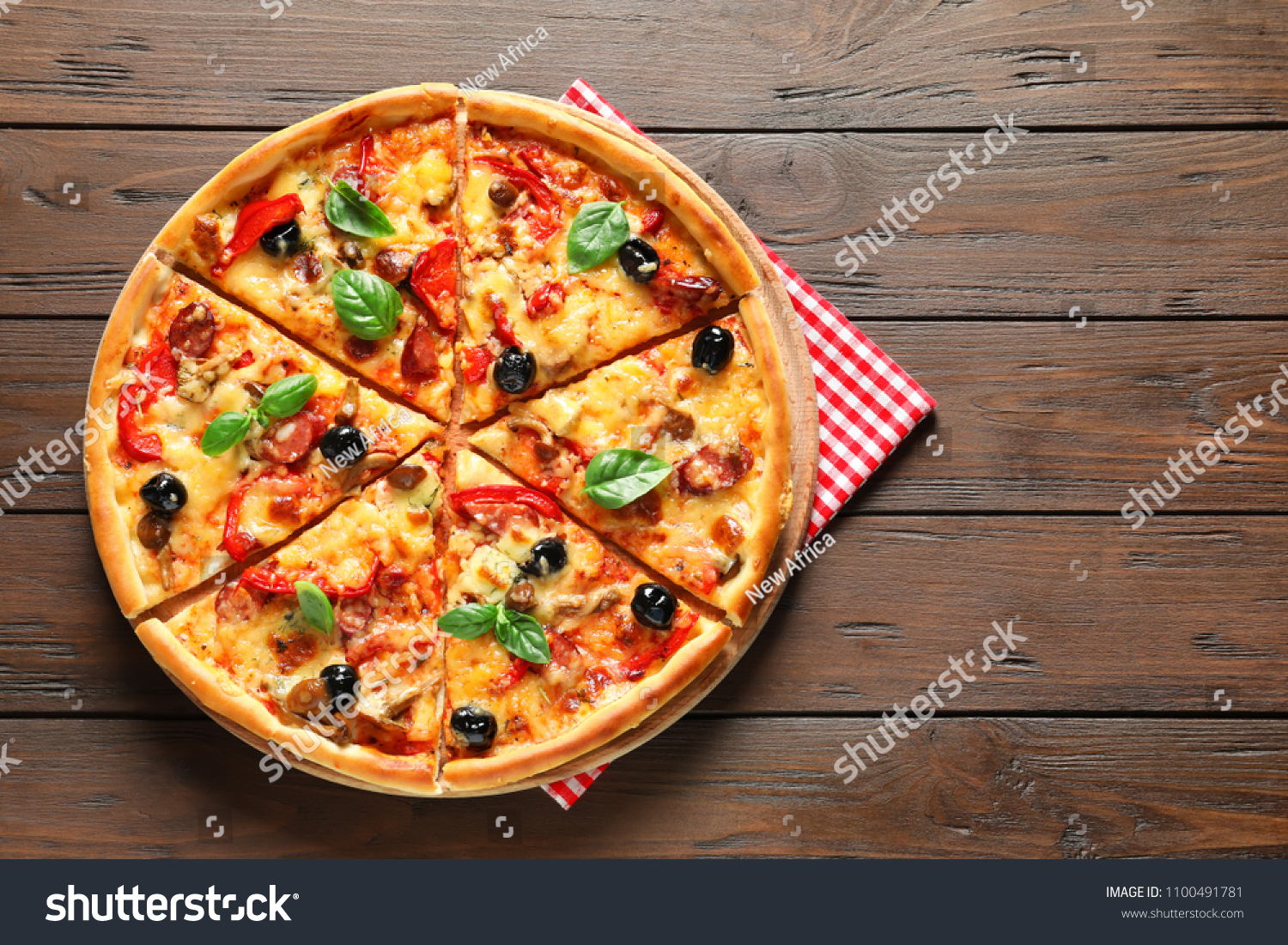 Delicious pizza with olives and sausages on wooden table, top view #1100491781