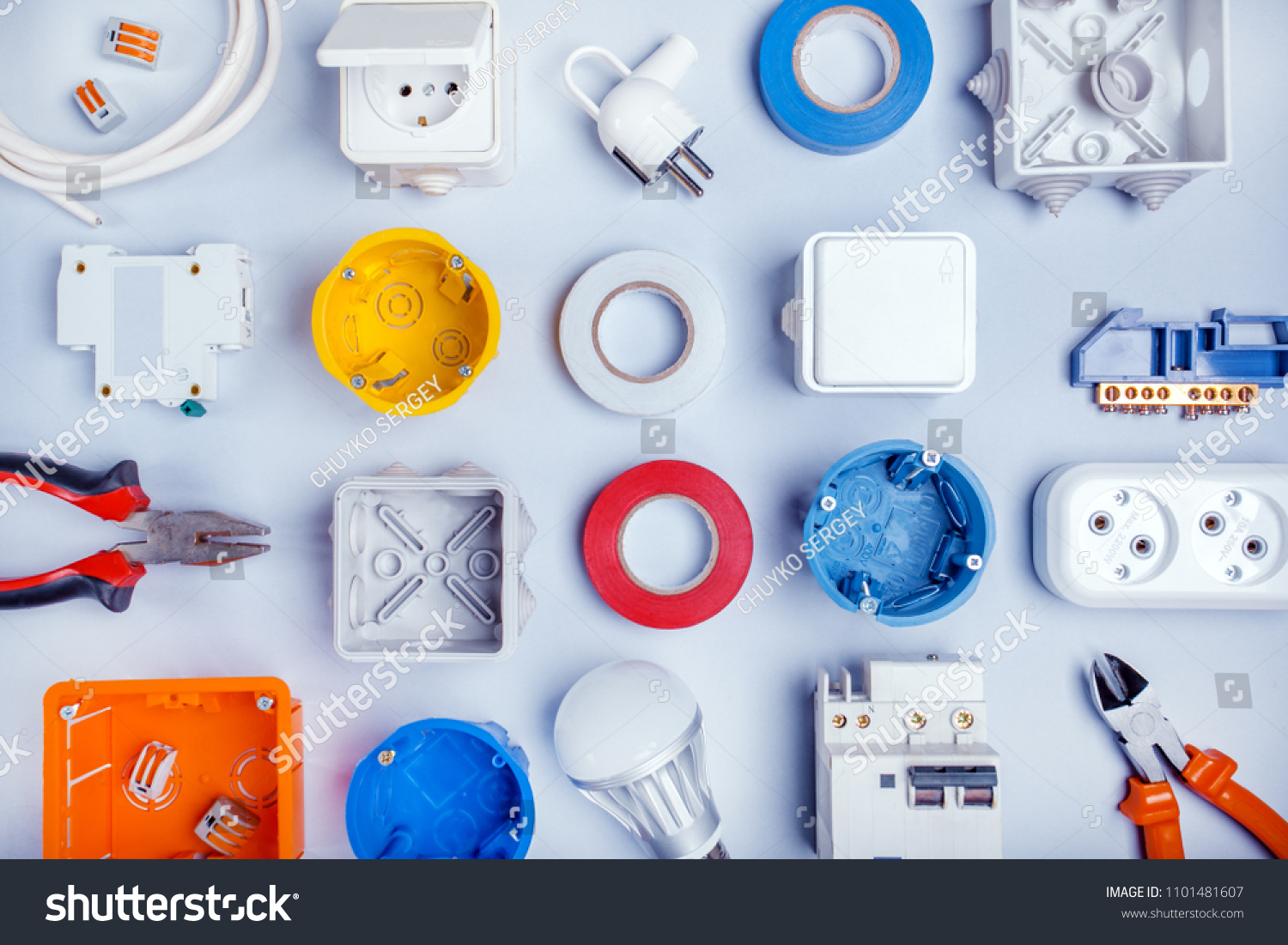Different electrical tools on light grey background with plase for text, top view. #1101481607