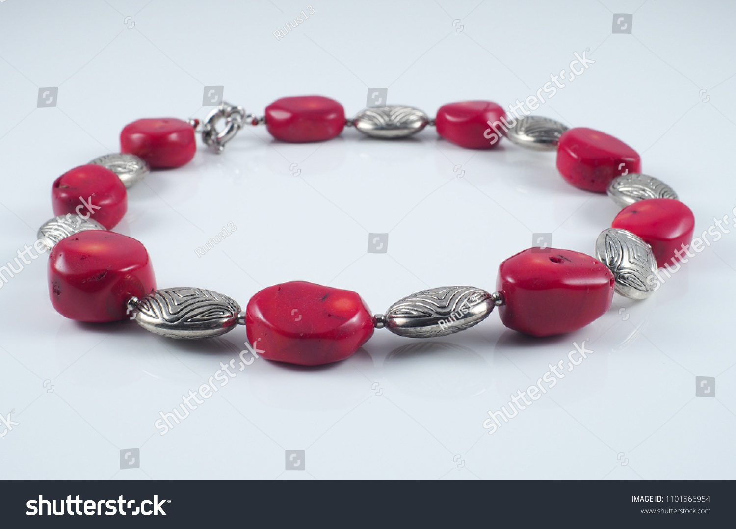 Red glass coral metal necklace isolated on white #1101566954