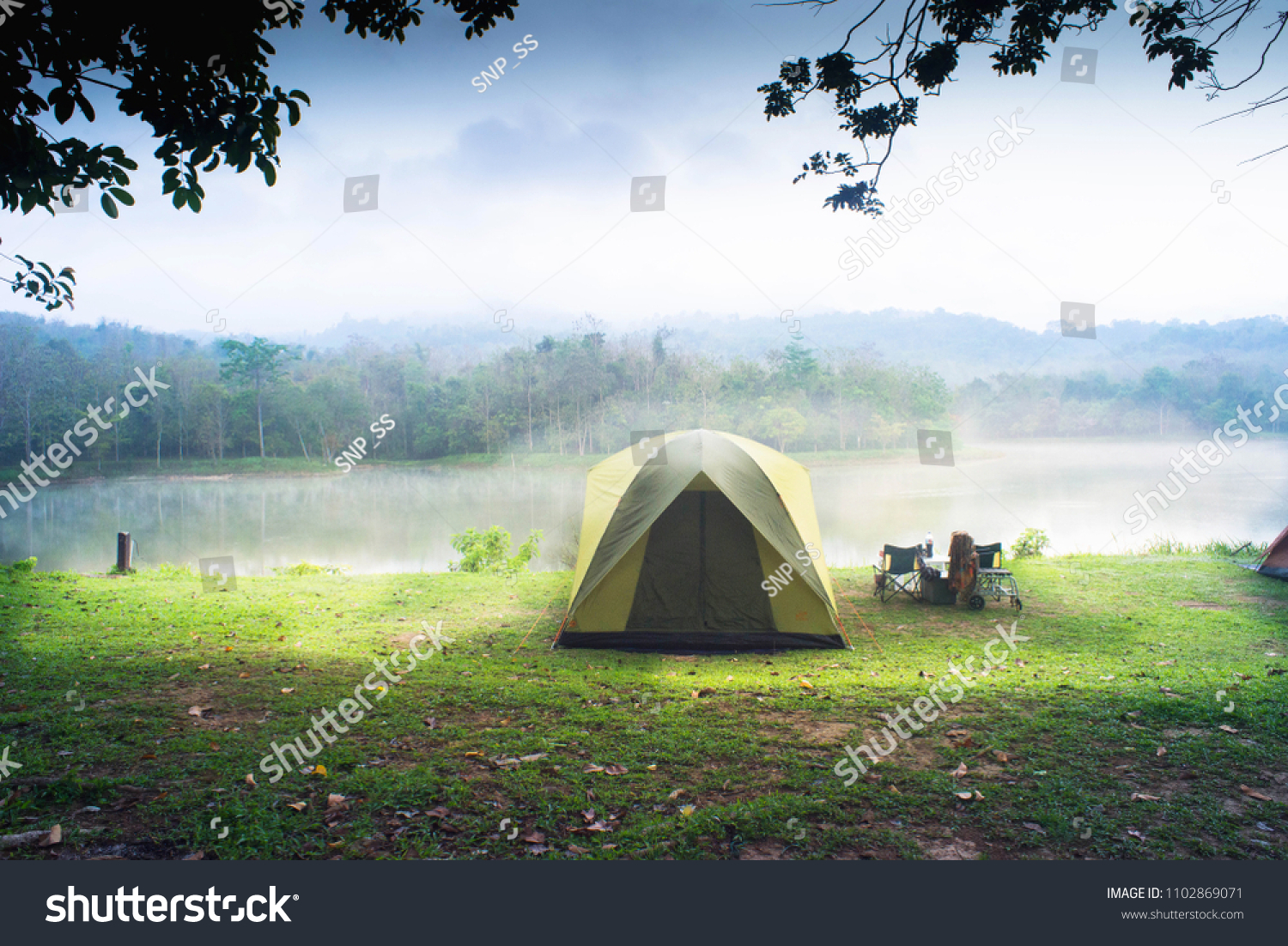 Camping tent with lake background. #1102869071