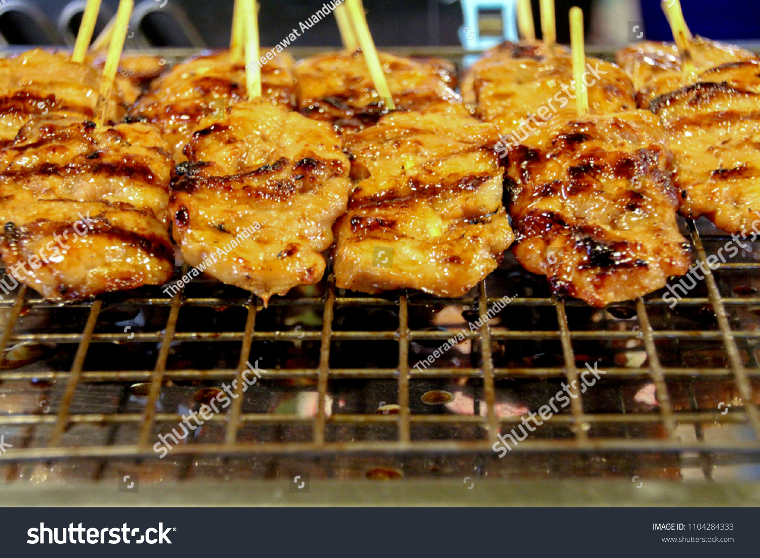 Grilled Pork with Bamboo wooden.There is space for iron grids and rectangular sections of steel grid. #1104284333