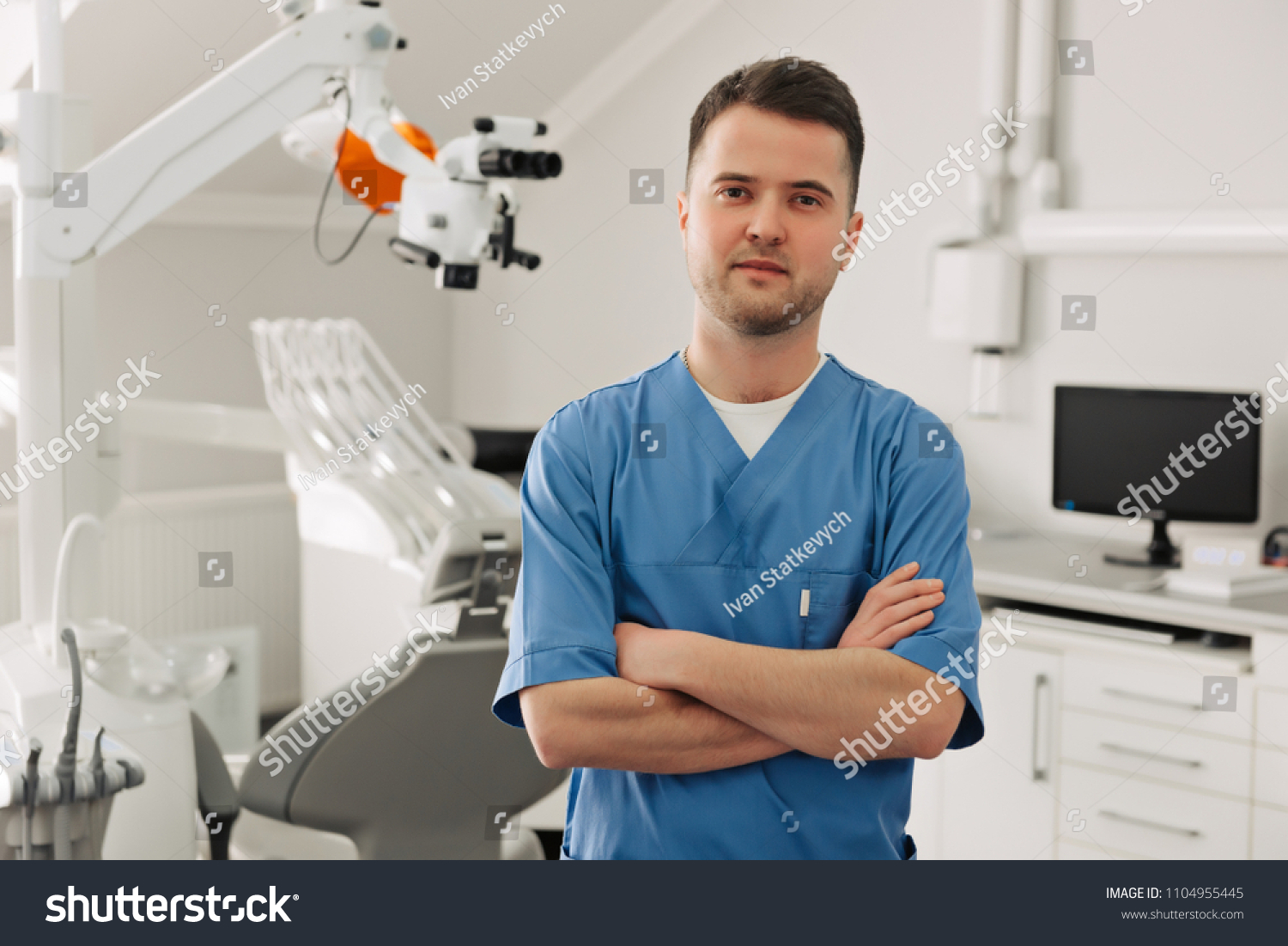 people, medicine, stomatology and healthcare concept - happy young male dentist with tools over medical office background #1104955445