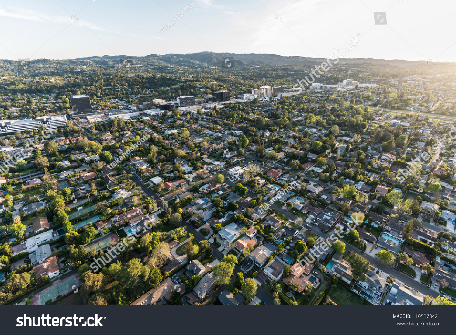 Late afternoon aerial view of Sherman Oaks and Encino in the San Fernando Valley area of Los Angeles, California. #1105378421