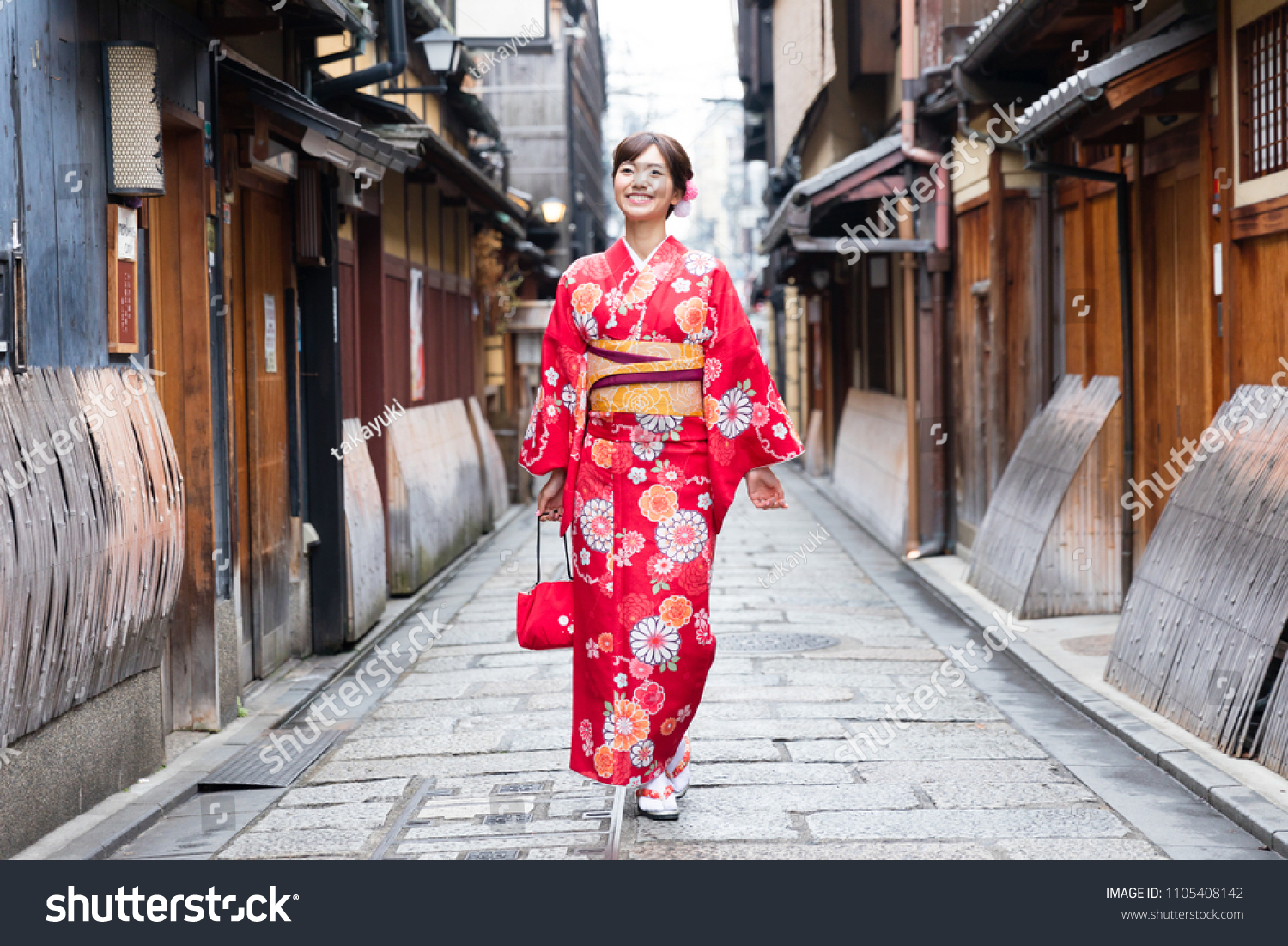 attractive asian woman wearing kimono in autumn #1105408142