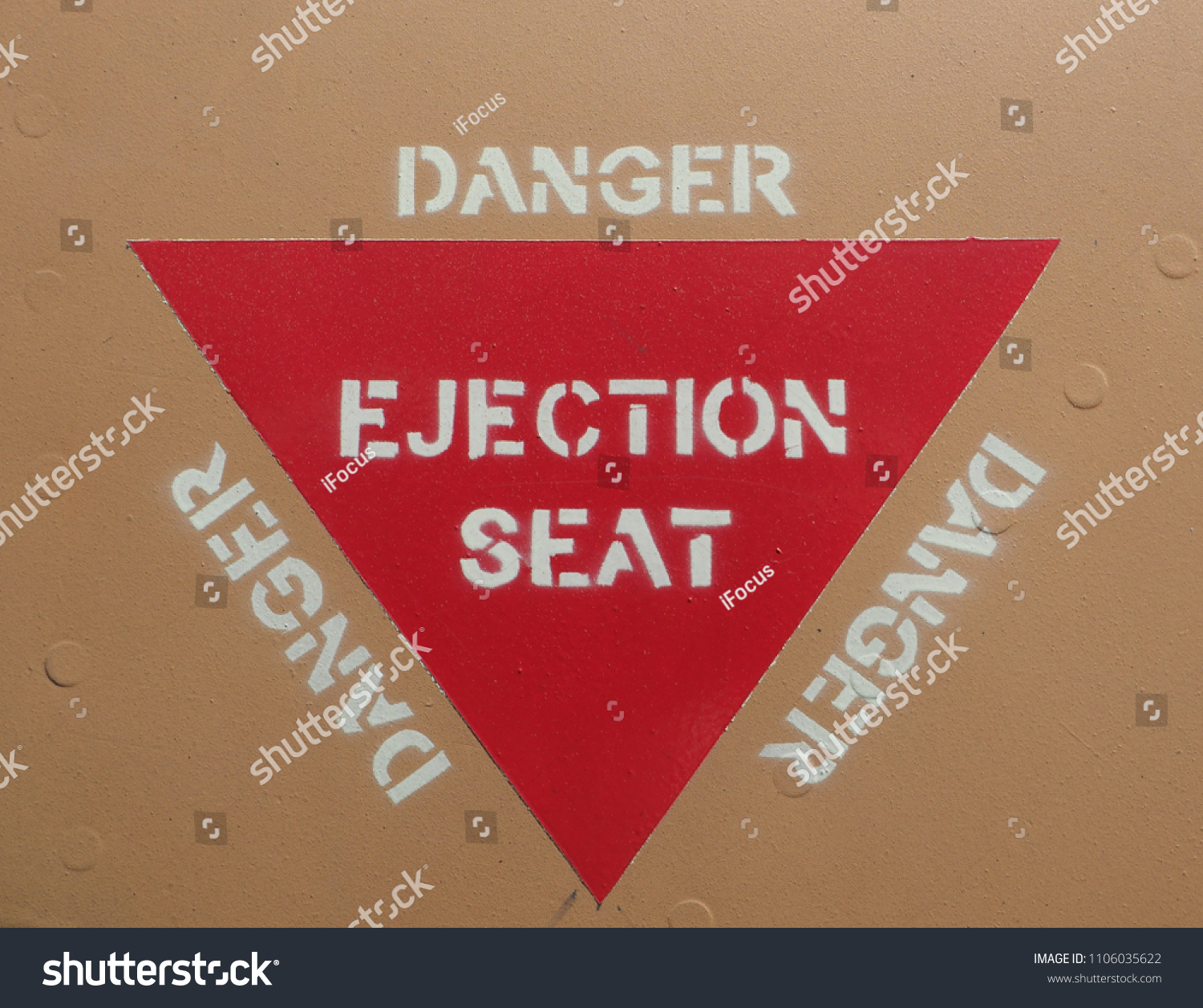 Ejection seat warning sign on fuselage background #1106035622
