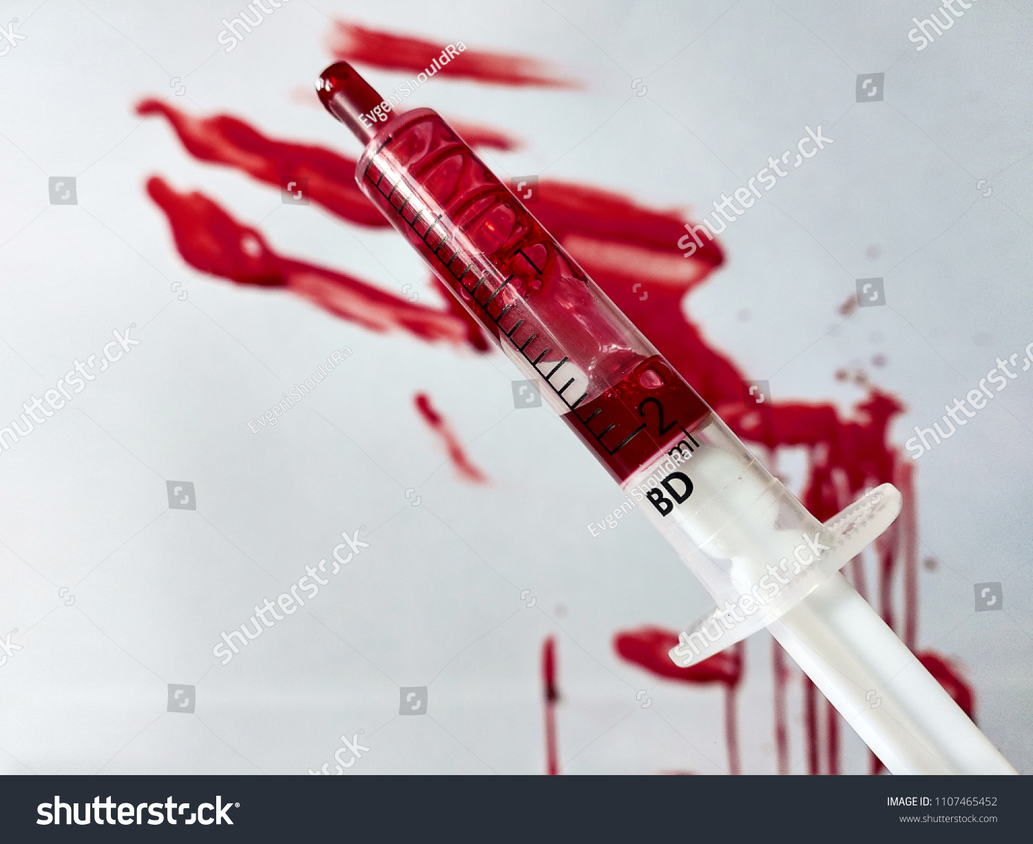 Syringe and blood splats and smears #1107465452