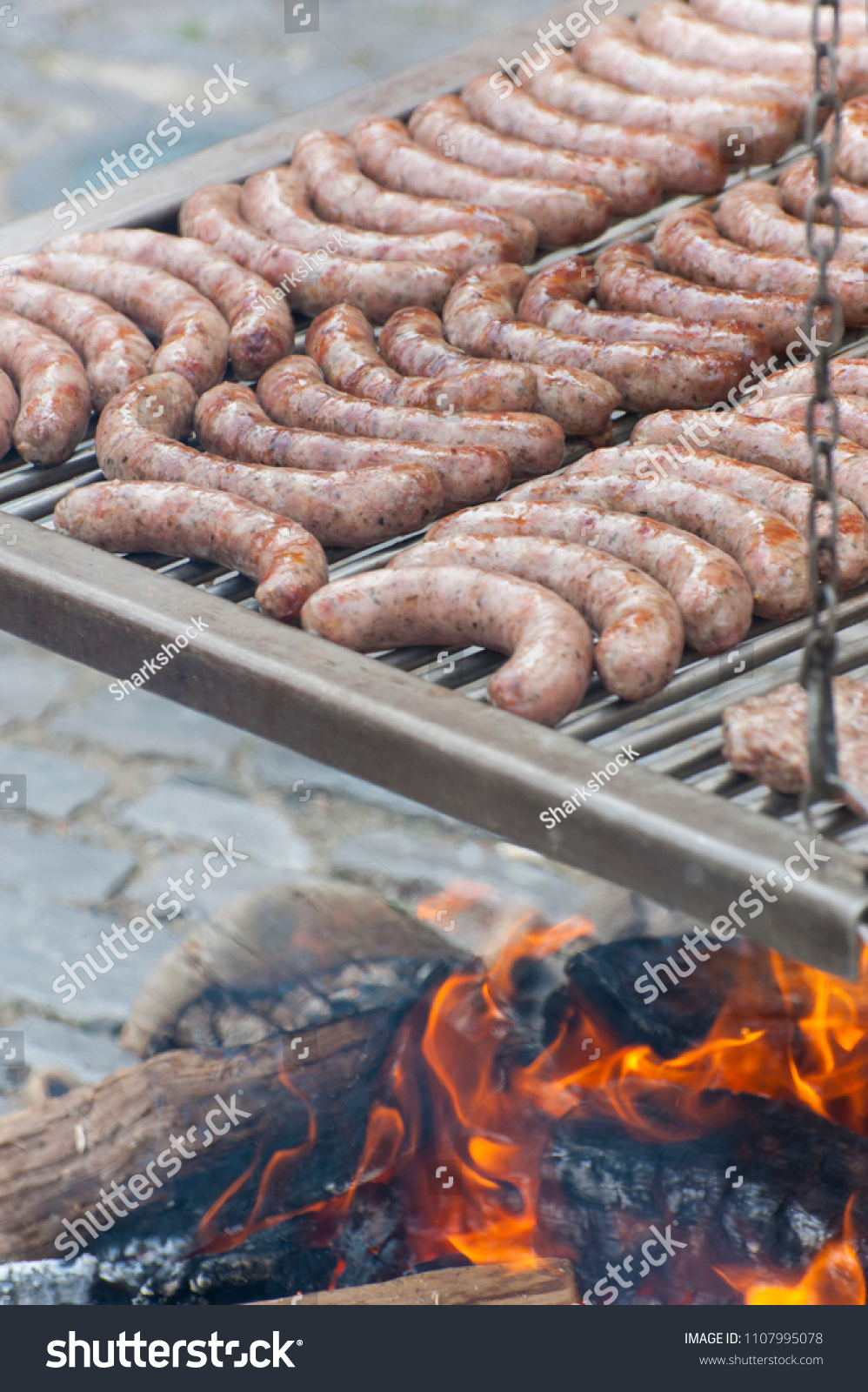 Sausages are grilled using a medieval method in Rothenburg ob der Tauber, Germany. #1107995078