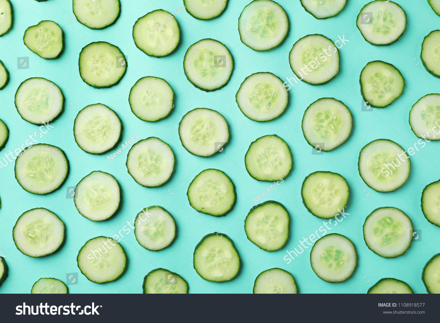 Flat lay composition with slices of cucumber on color background #1108918577