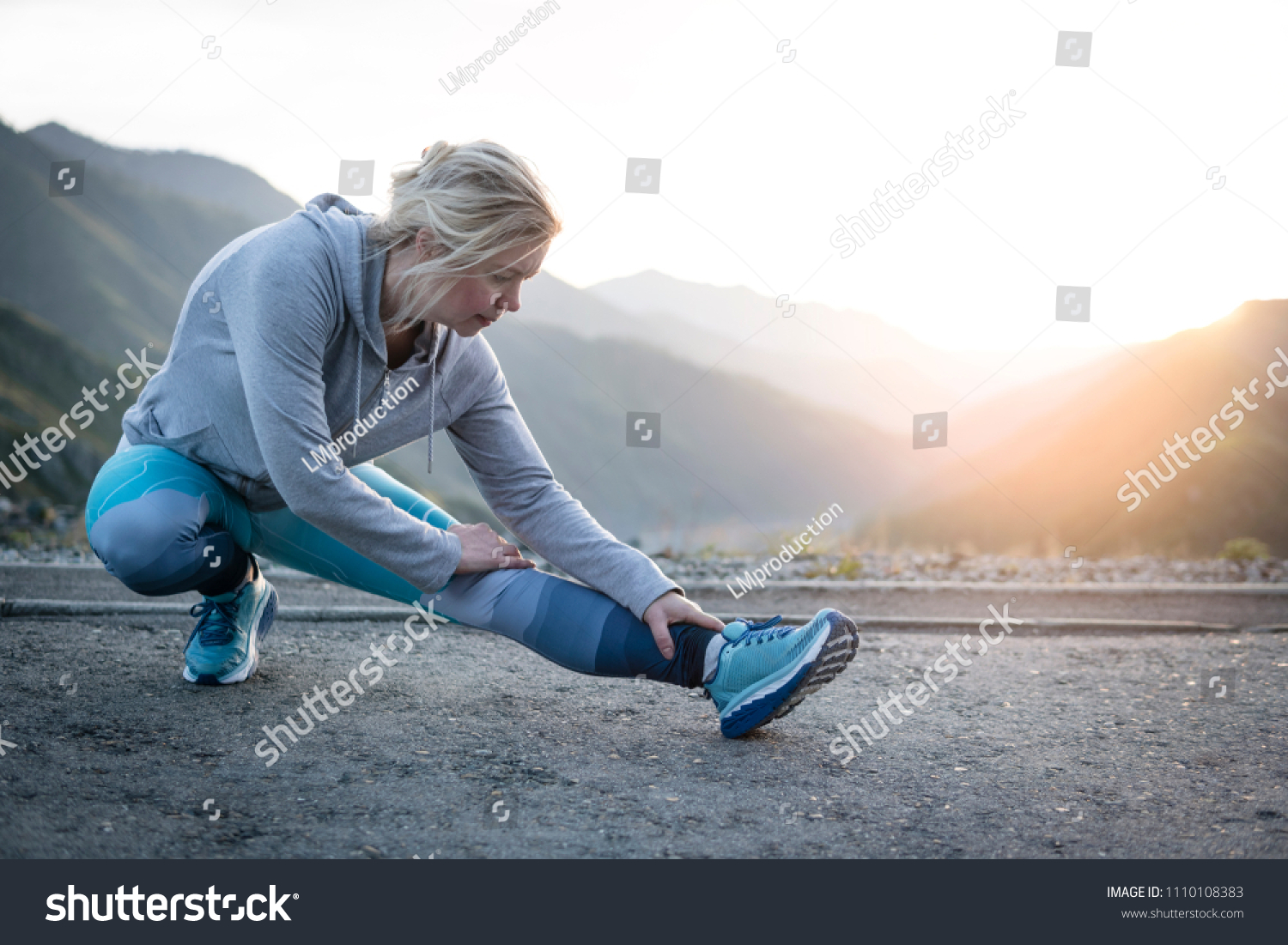 Exercising adult woman outdoors. Sports and recreation #1110108383