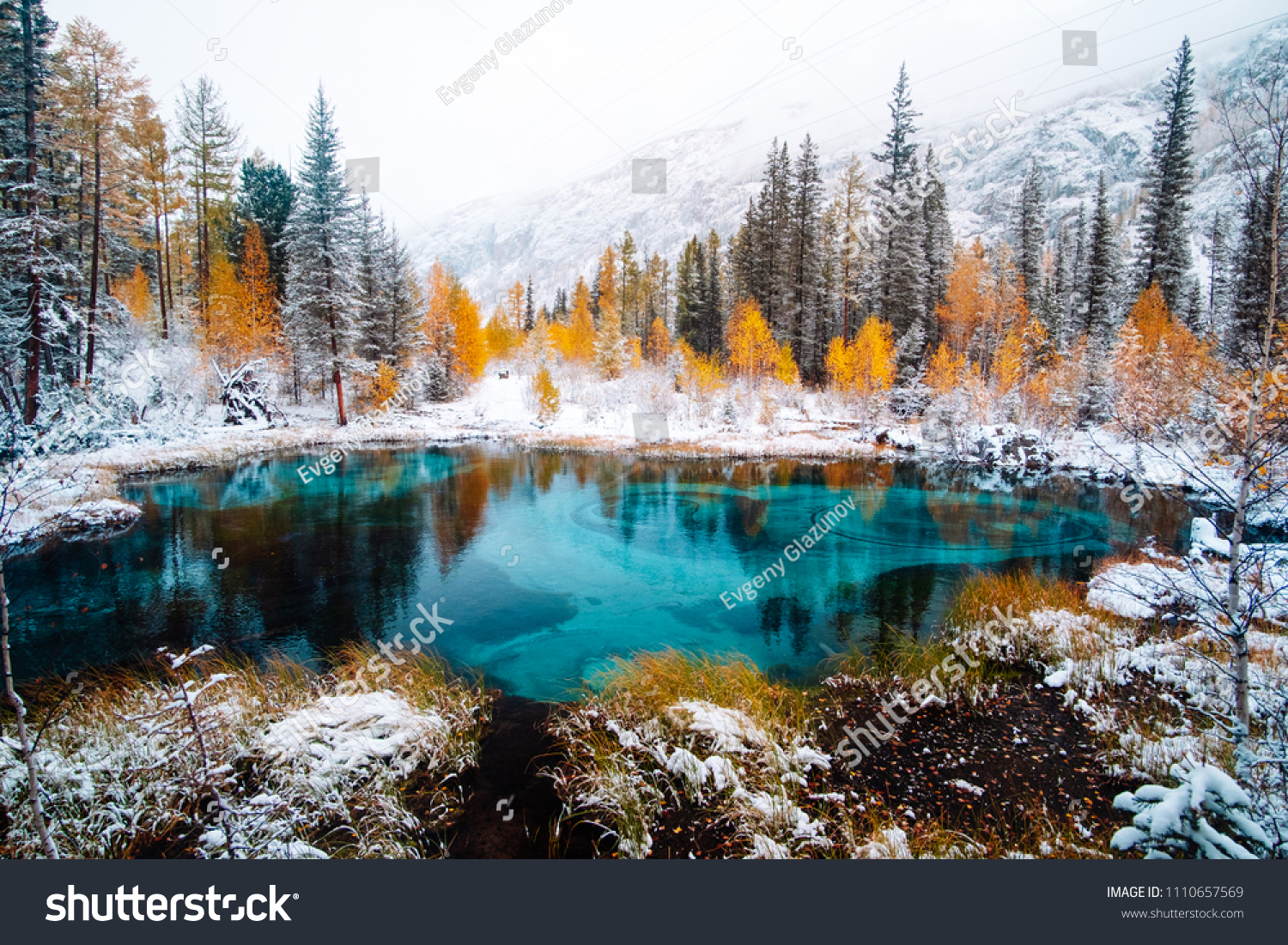 Fantastic blue geyser lake in the autumn forest. Altai, Russia #1110657569
