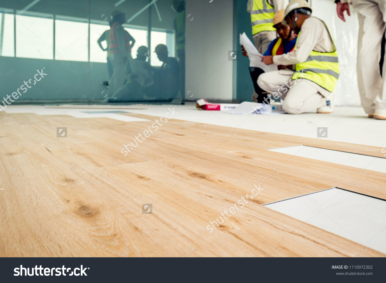 Installing wooden laminate flooring #1110972302