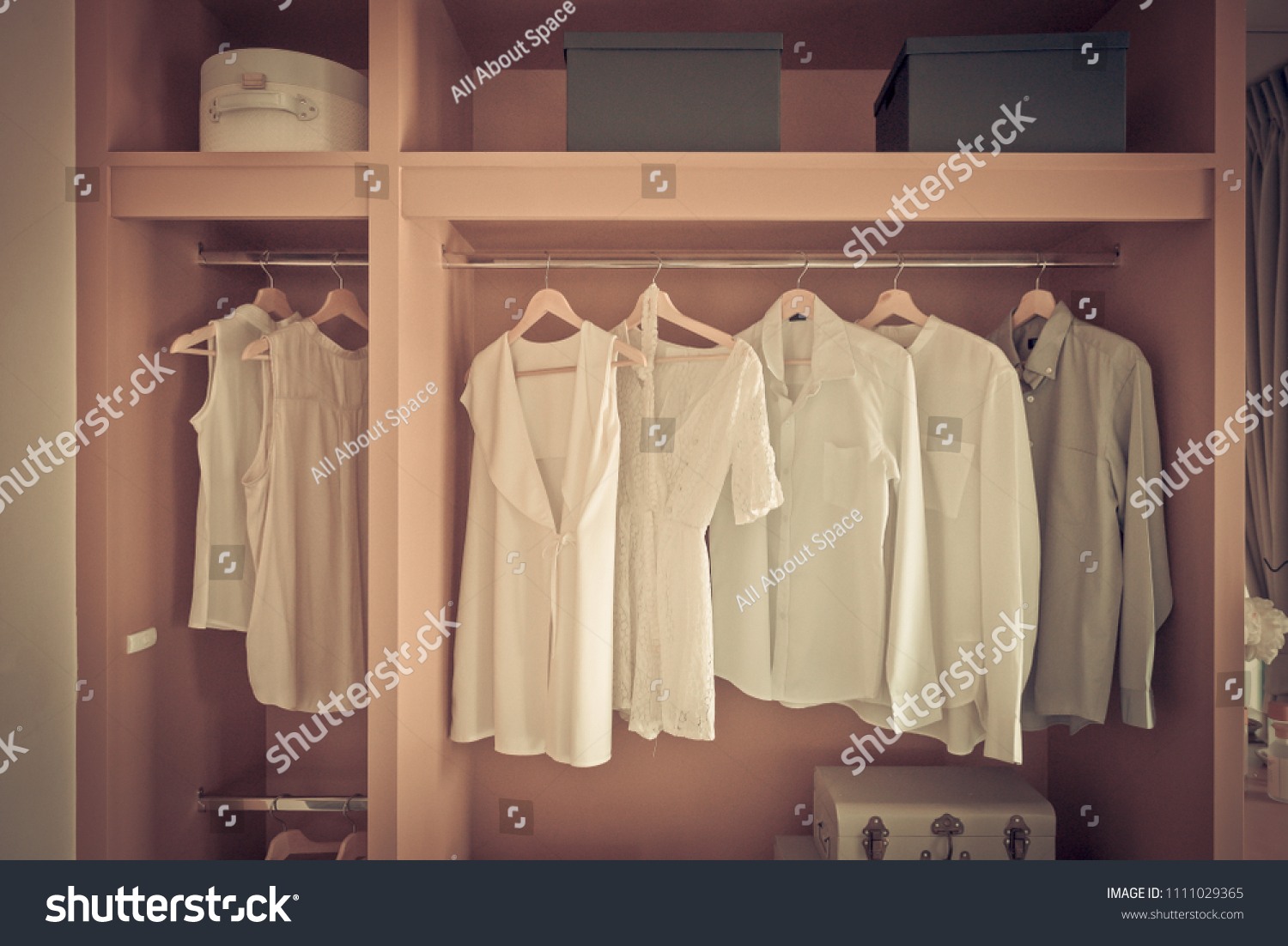 white color shirts hanging on rail in modern wooden closet, interior design concept, vintage style process #1111029365