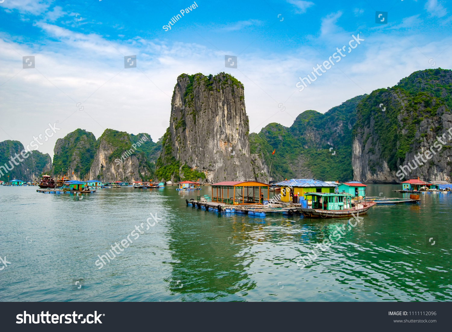 Fisherman's village standing on the water in Halong Bay. Vietnam #1111112096