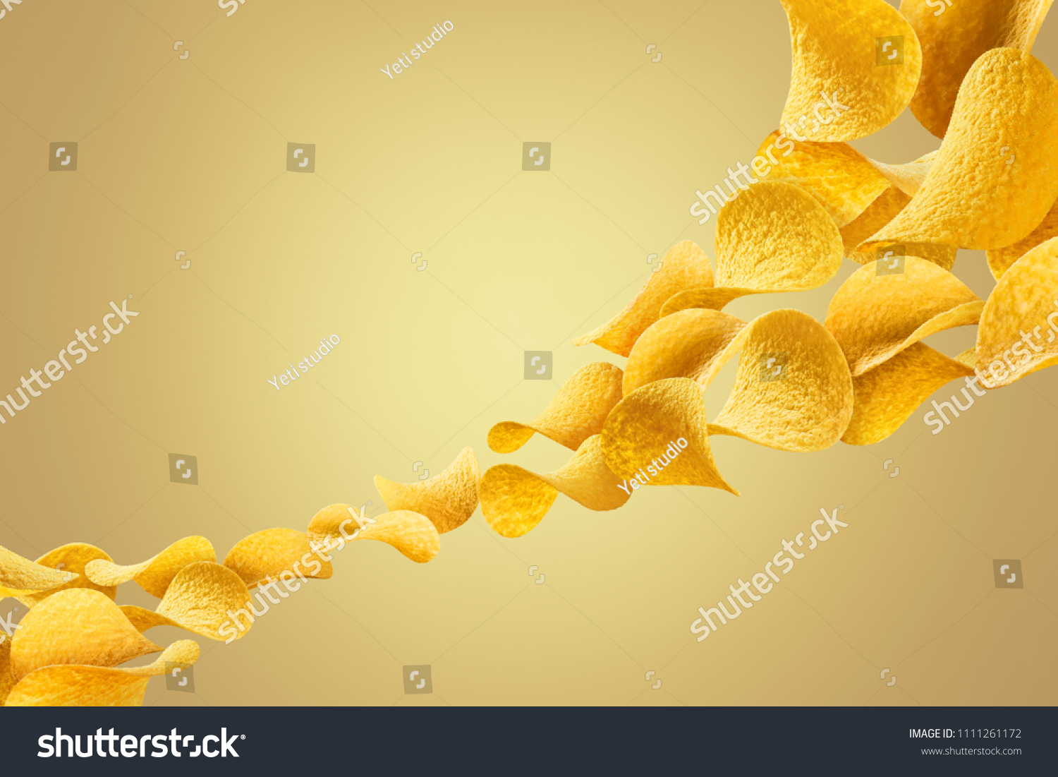 Flying potato chips, isolated on yellow gradient background #1111261172
