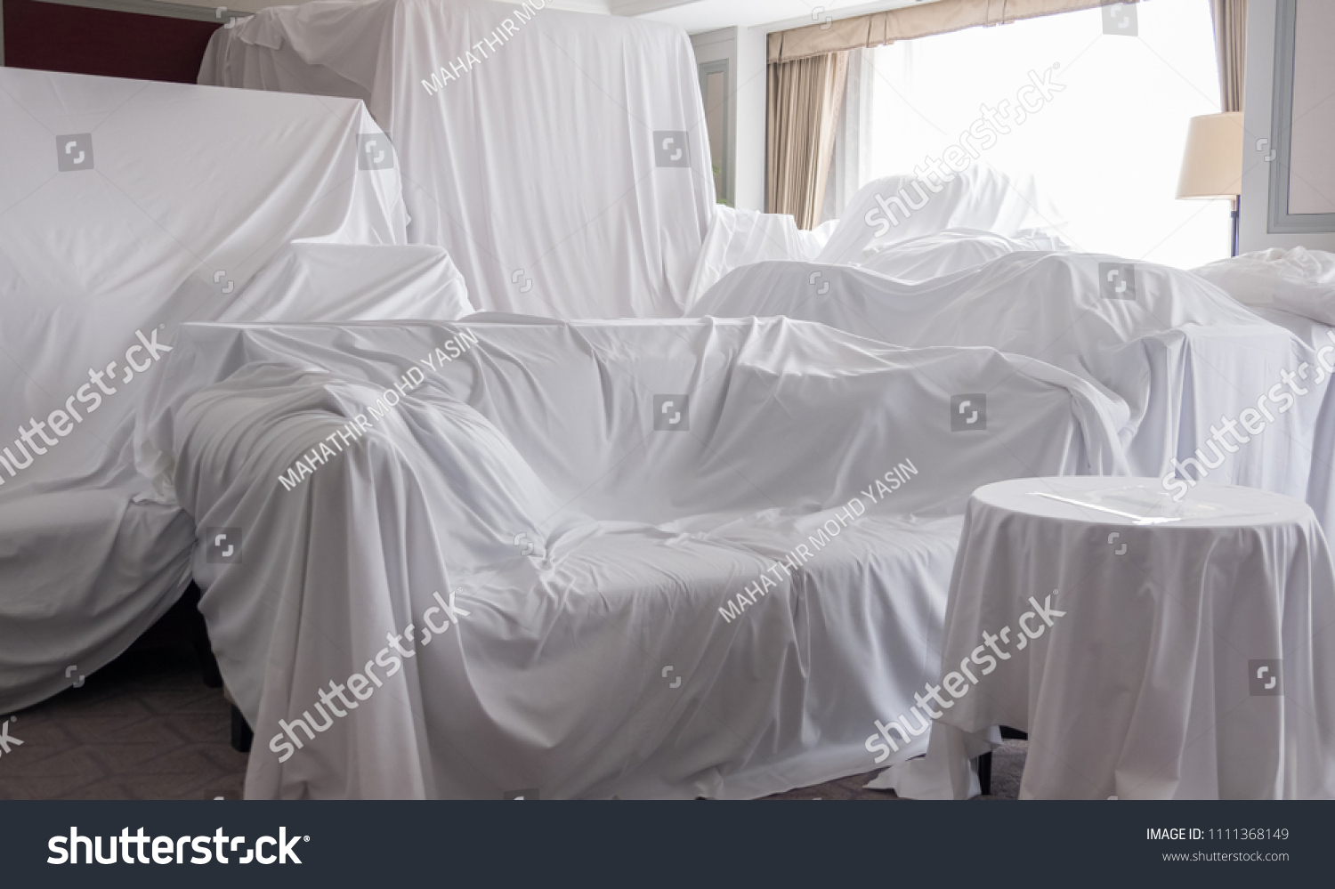 White dust cover cloth covering furnitures in a room #1111368149