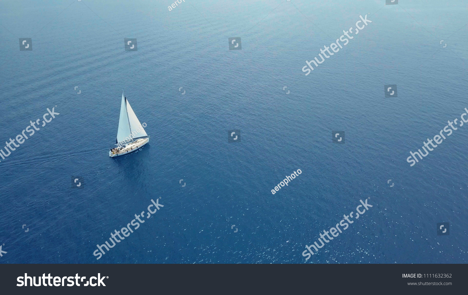 Yacht sailing on opened sea. Sailing boat. Yacht from drone. Yachting video. Yacht from above. Sailboat from drone. Sailing video. Yachting at windy day. Yacht. Sailboat. #1111632362