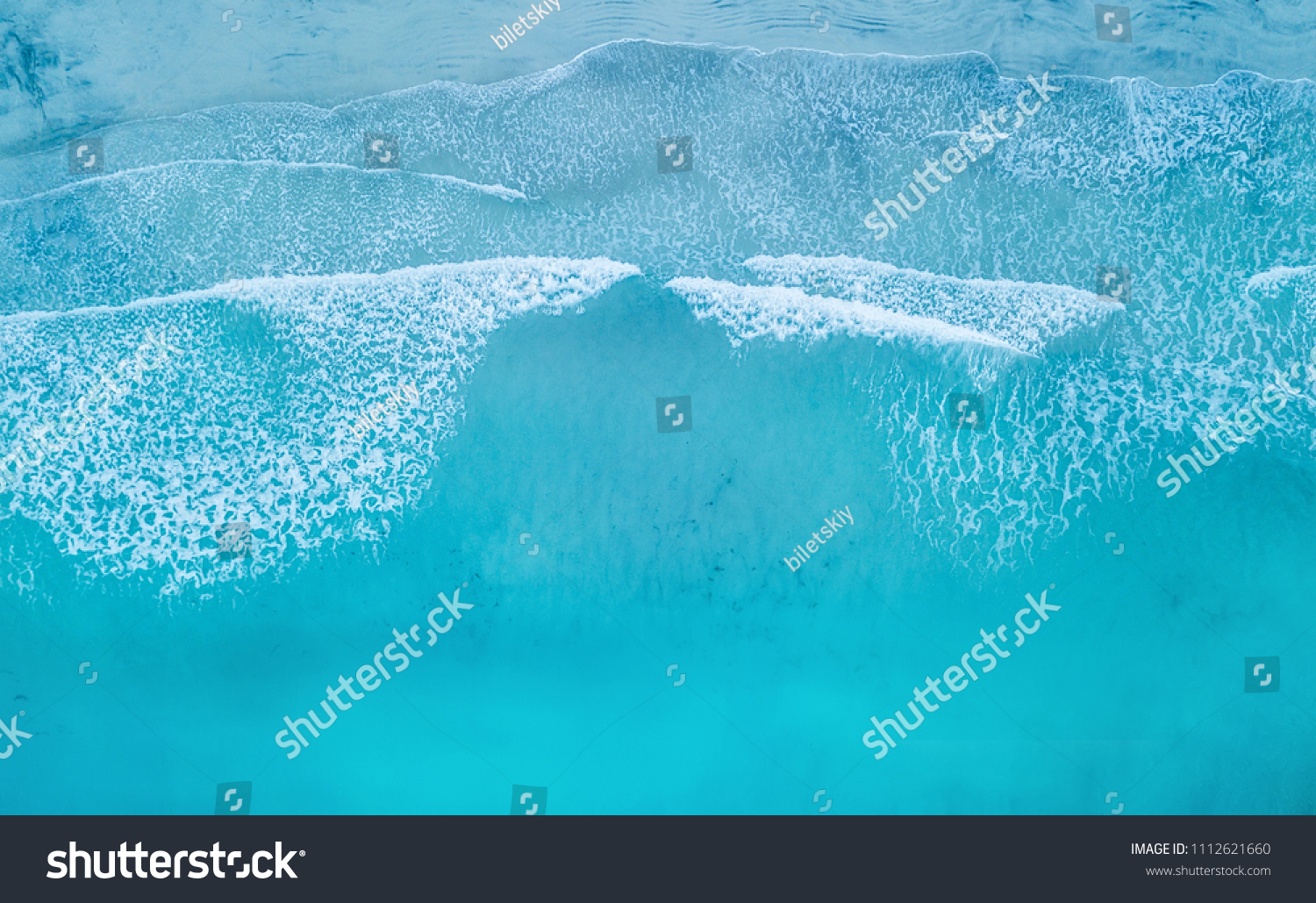Wave on the beach as a background. Beautiful natural background at the summer time #1112621660
