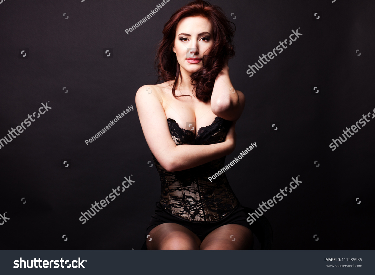 sexy woman  posing over dark background #111285935