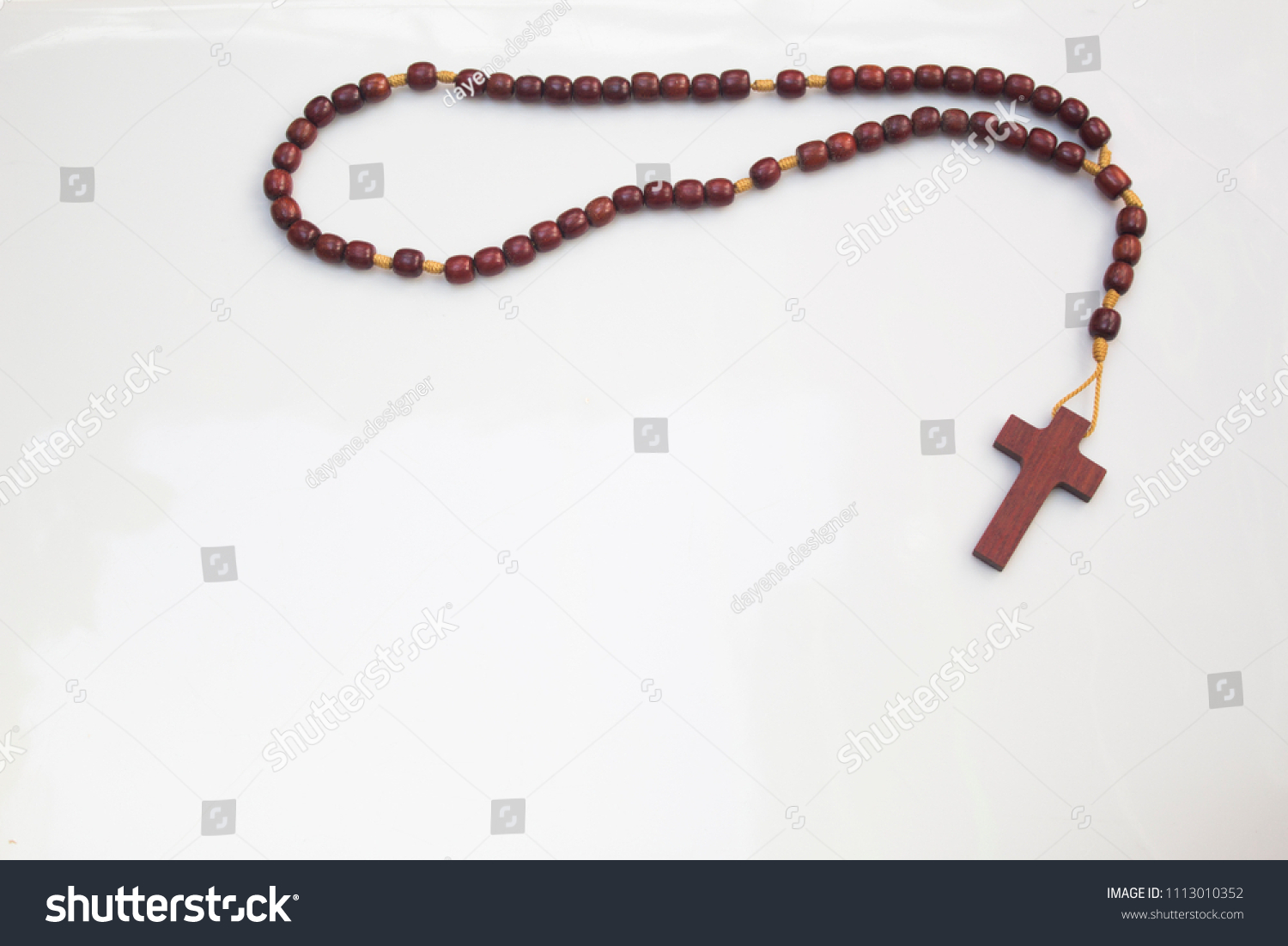 Wood rosary in white background #1113010352