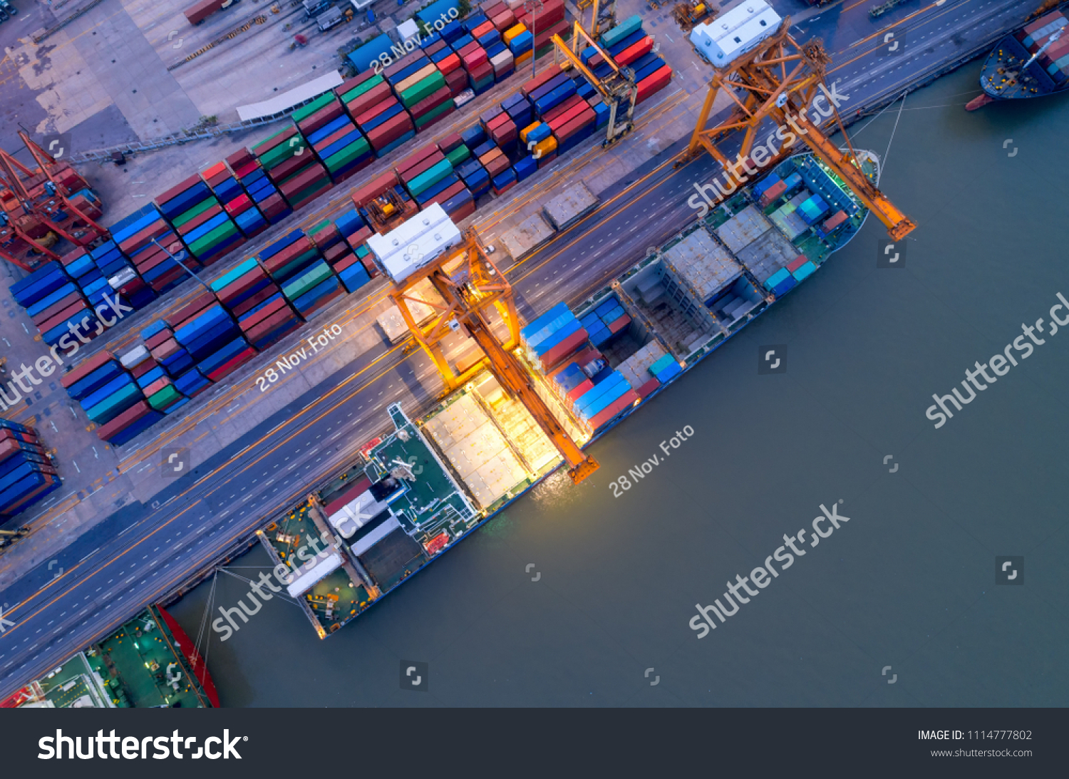 Aerial view of business port with shore crane loading container in container ship in import/export and business logistics with crane and shipping port cargo.International transportation  port concept. #1114777802