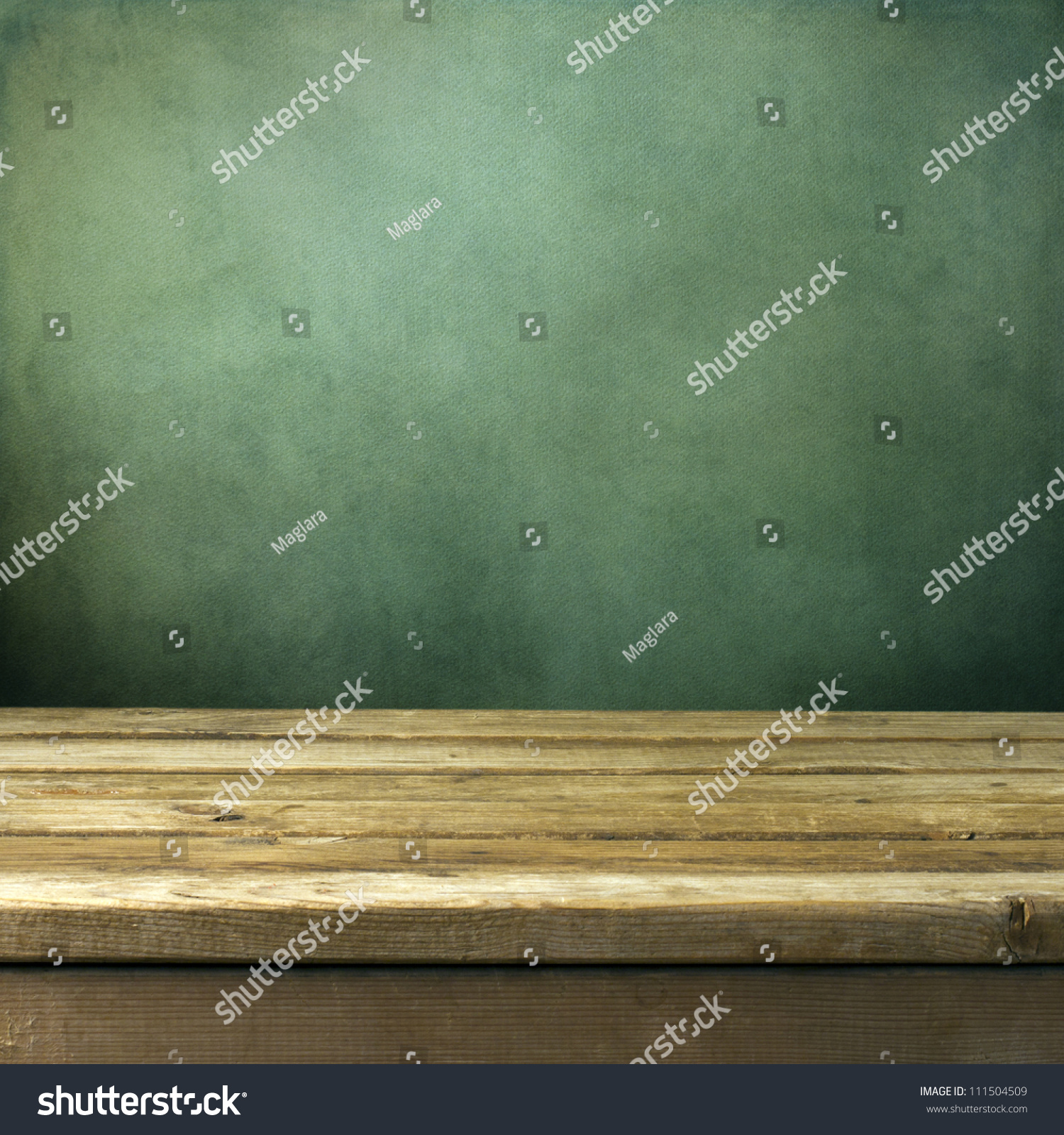 Wooden deck table on green grunge background #111504509