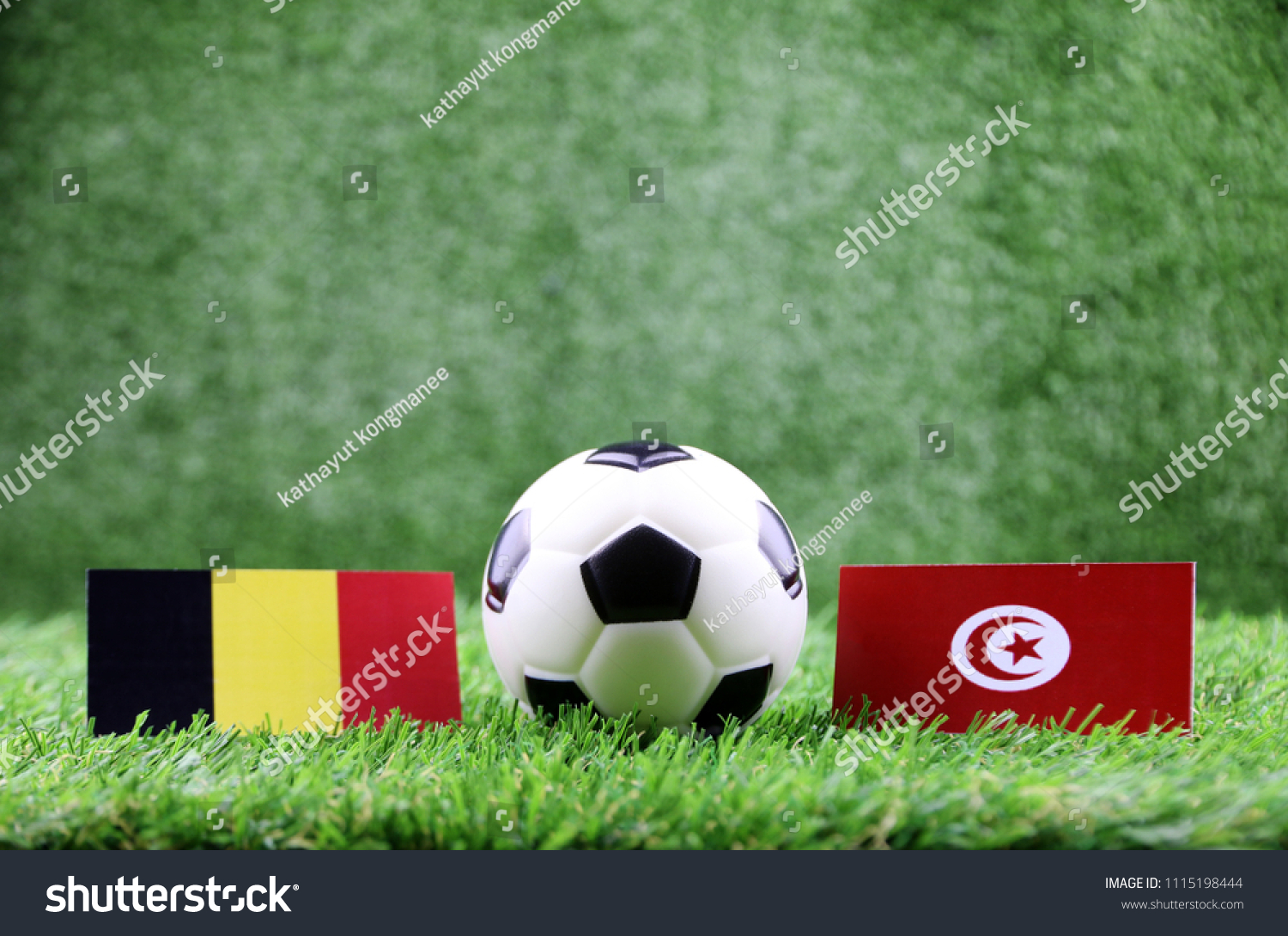 ball with Belgium VS Tunisia
 flag match on Green grass football 2018 #1115198444
