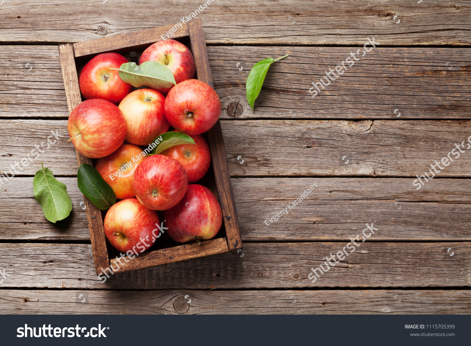 Ripe red apples in wooden box. Top view with space for your text #1115705399