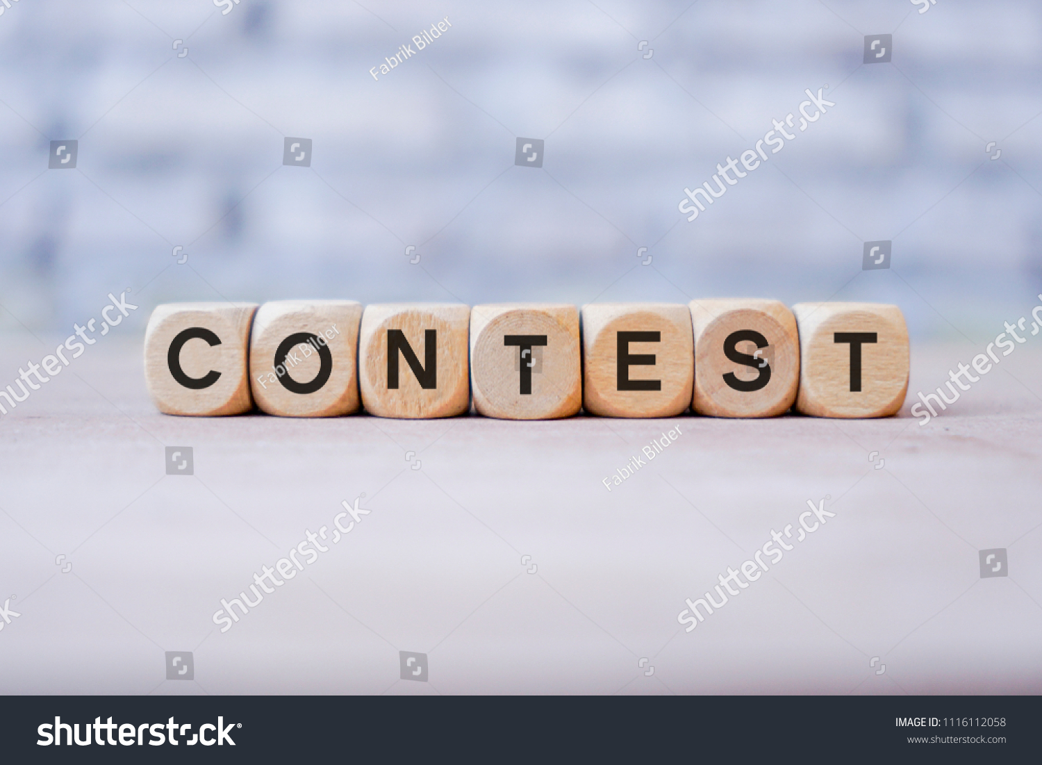 Contest word written on wood block #1116112058