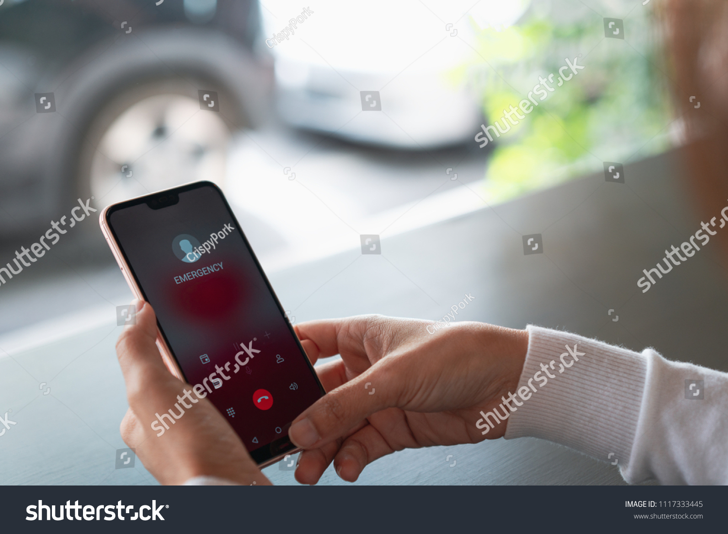 Emergency call use by smartphone, Women using a digital generated phone with emergency call on the screen. All screen graphics are made up, Emergency concept #1117333445