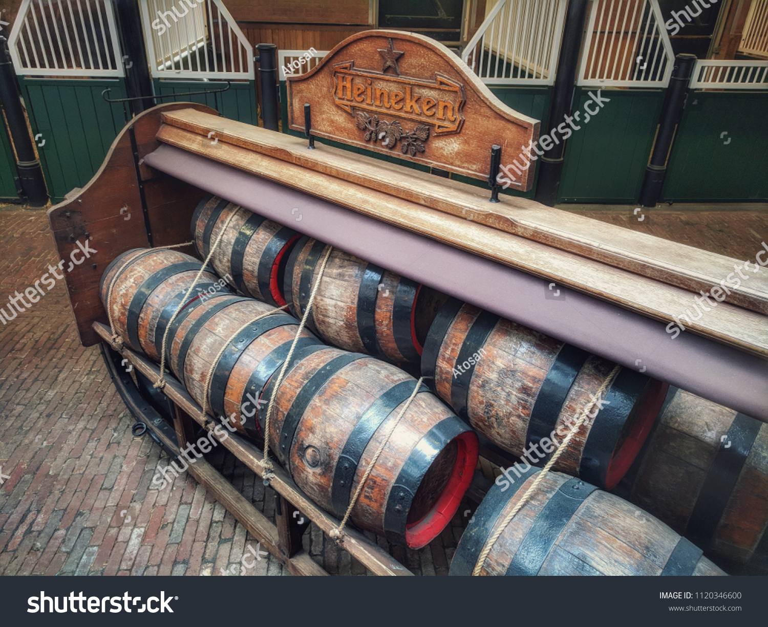 Amsterdam, The Netherlands, June 23  2018: antique beer barrels at Heineken brewery  #1120346600