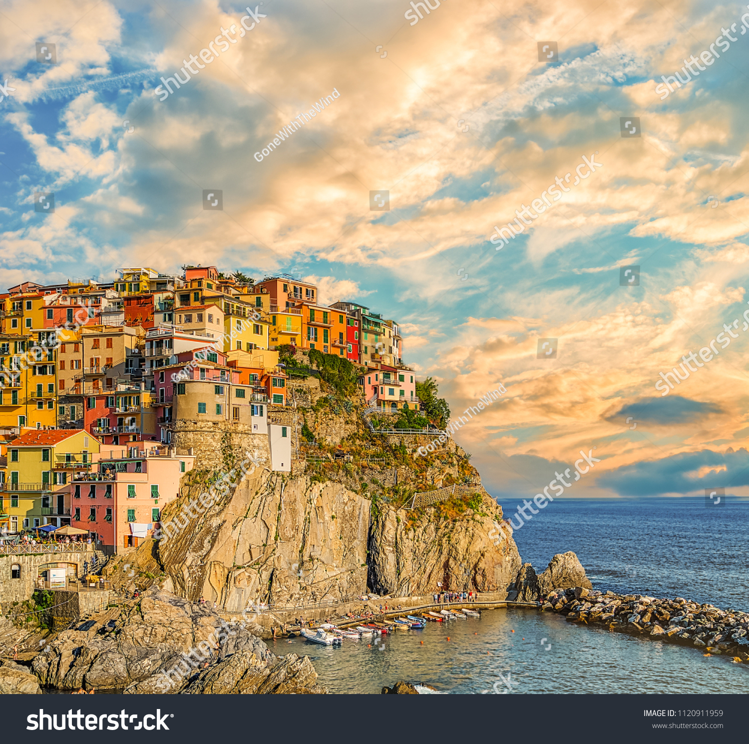 sunset on colorful fishing houses in Italian sea town #1120911959