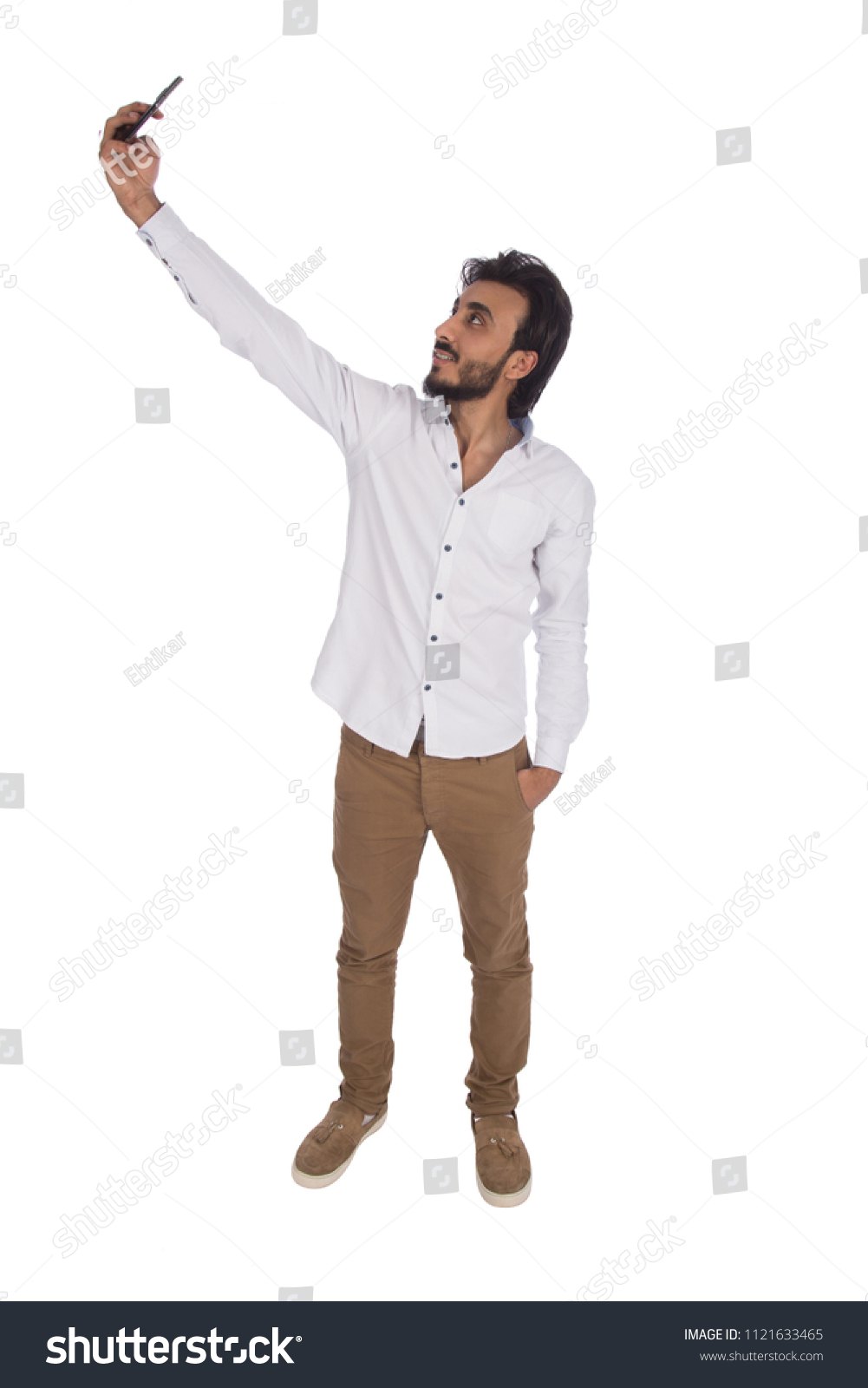 man taking selfie in casual wear in full length shot , isolated in white background #1121633465